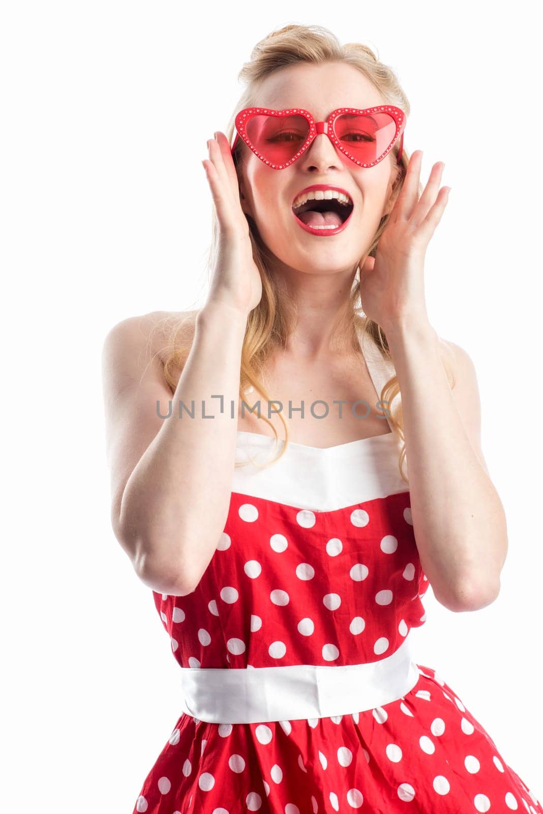 a woman in rockabilly dress wears sunglasses