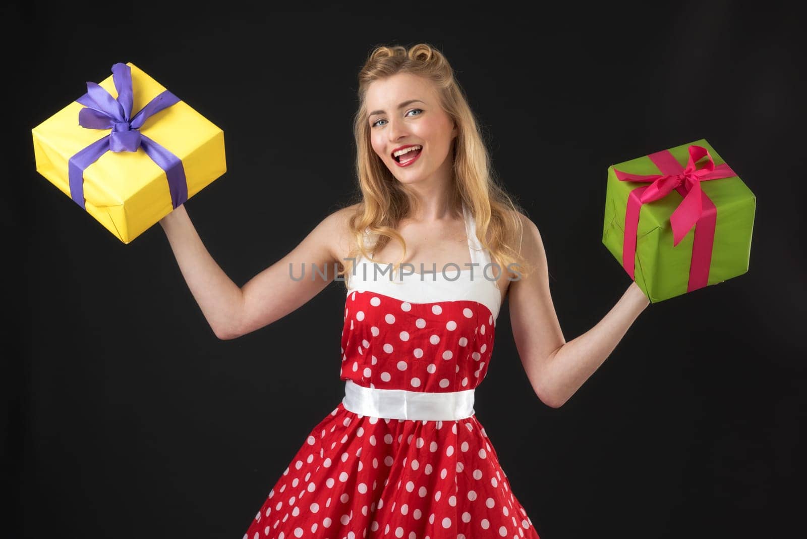 a pin up girl in summer dress keeps gifts