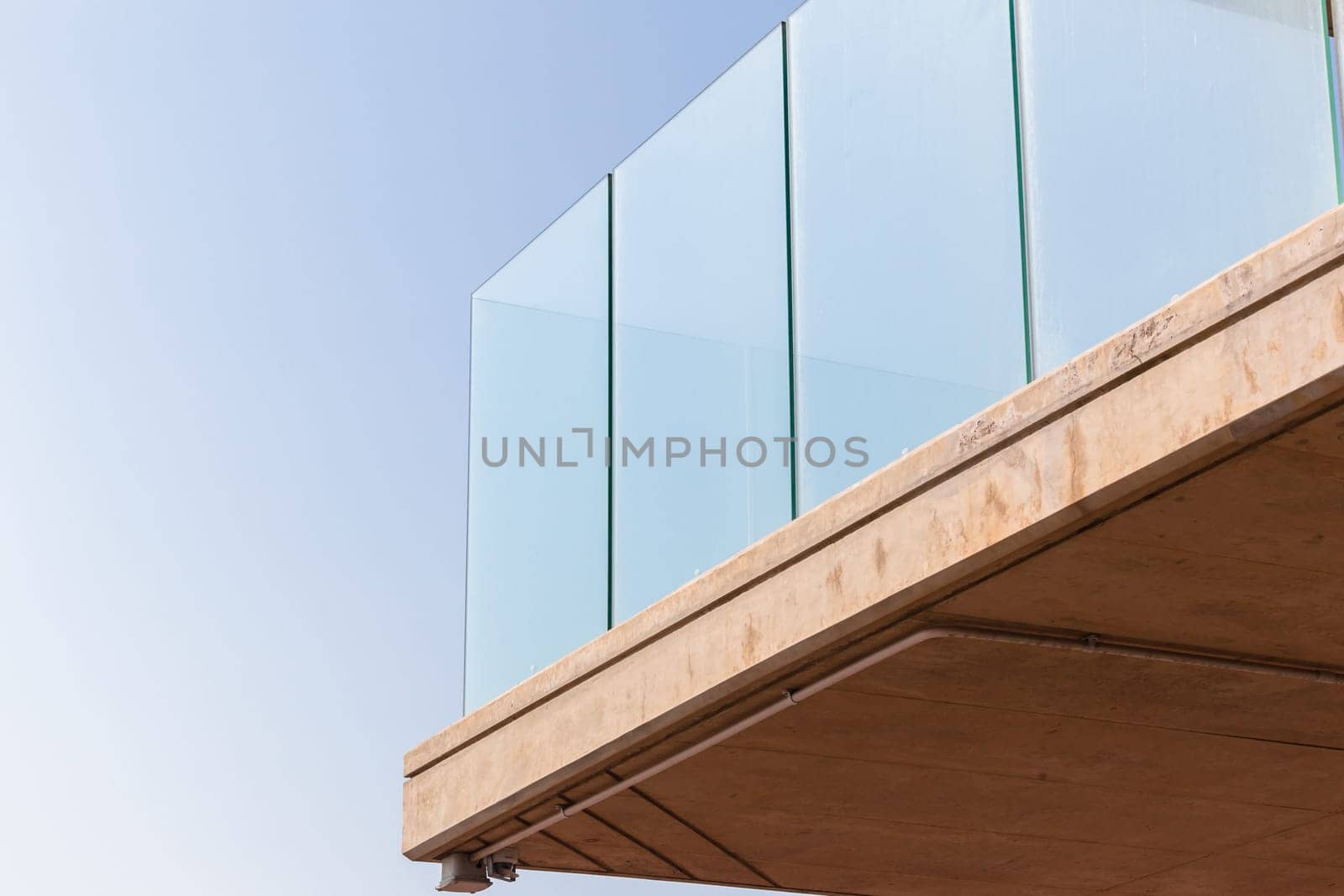 Building corner in concrete glass abstract section in blue sky