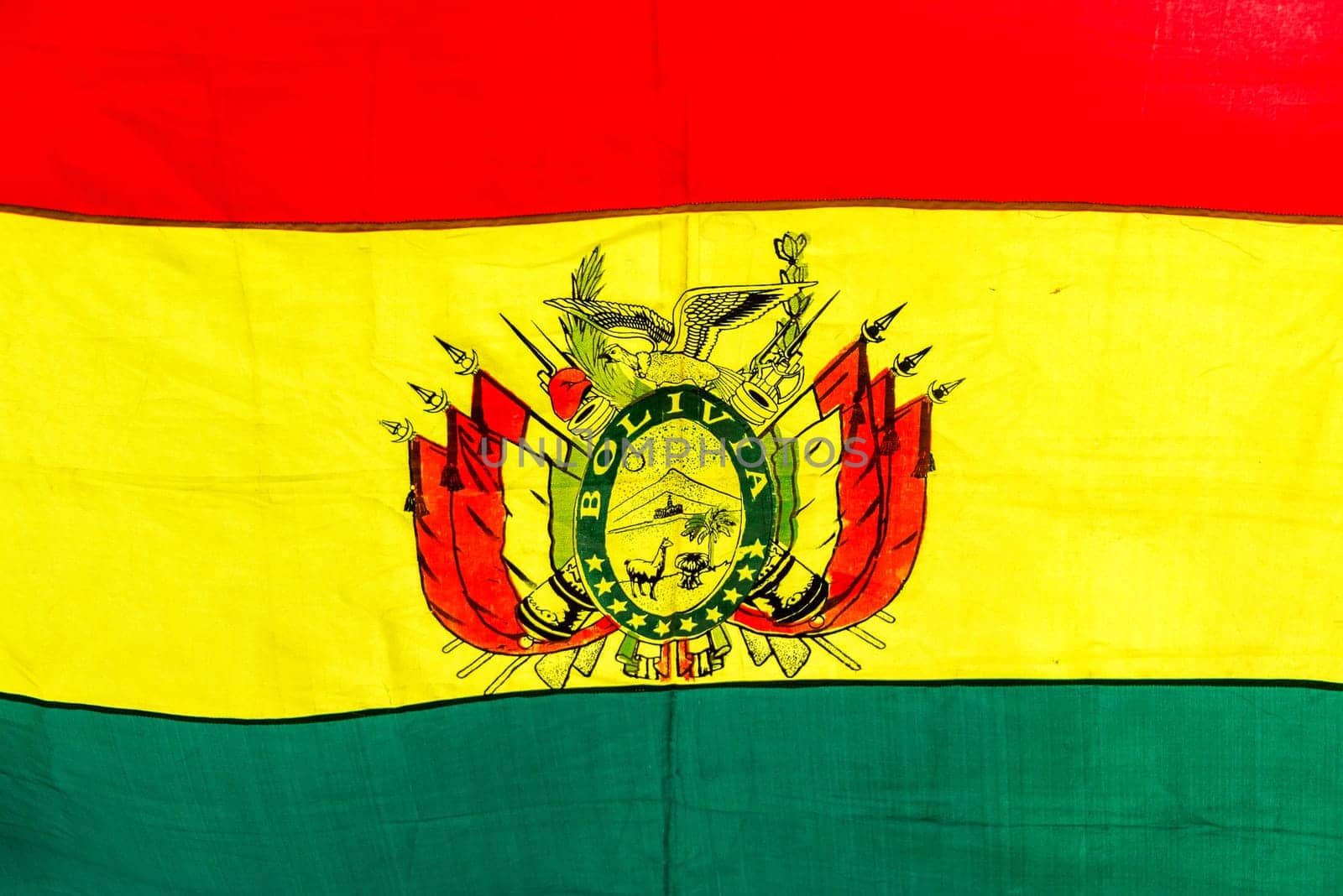 Closeup up view of the red, yellow, and green of the Bolivian flag