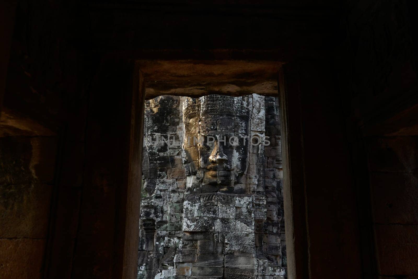 Stone Faces the Tempel Ruin of Angkor Thom in the Temple City of Angkor near the City of Siem Riep in the west of Cambodia.