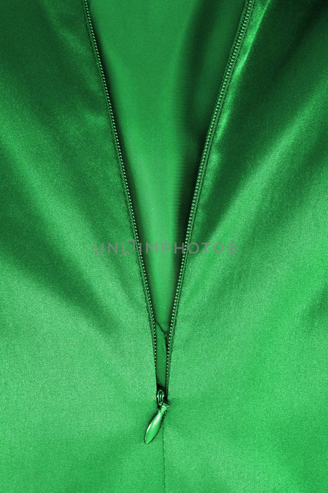 A close up shot of a zipper on a satin dress