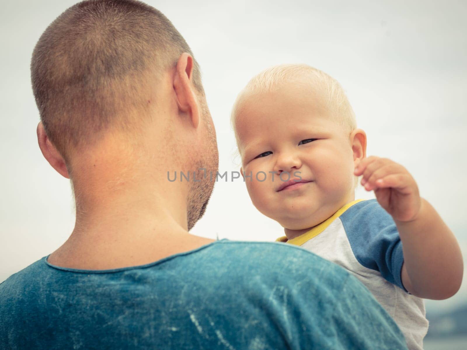 Baby and father outdoor portrait