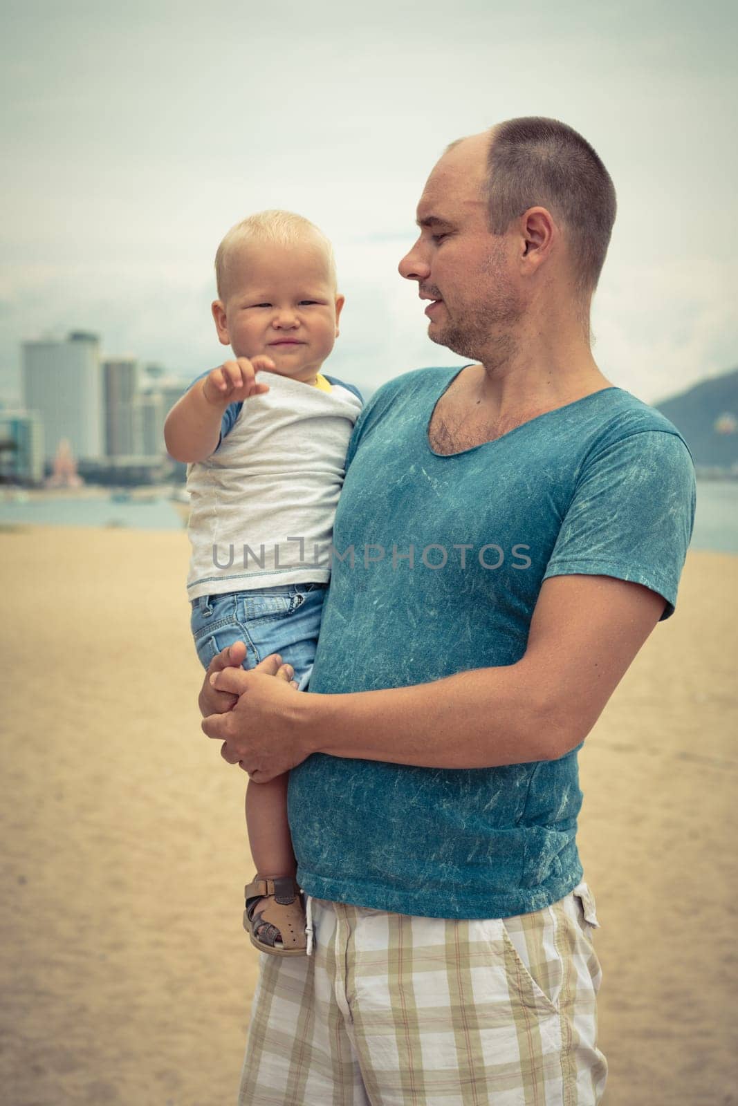 Baby and father outdoor portrait