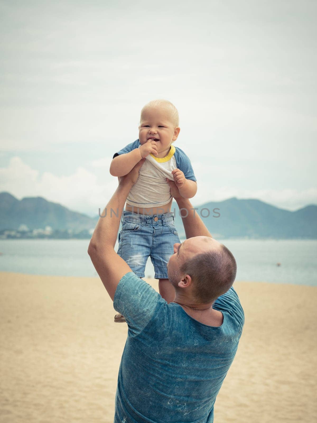 Baby and father outdoor portrait