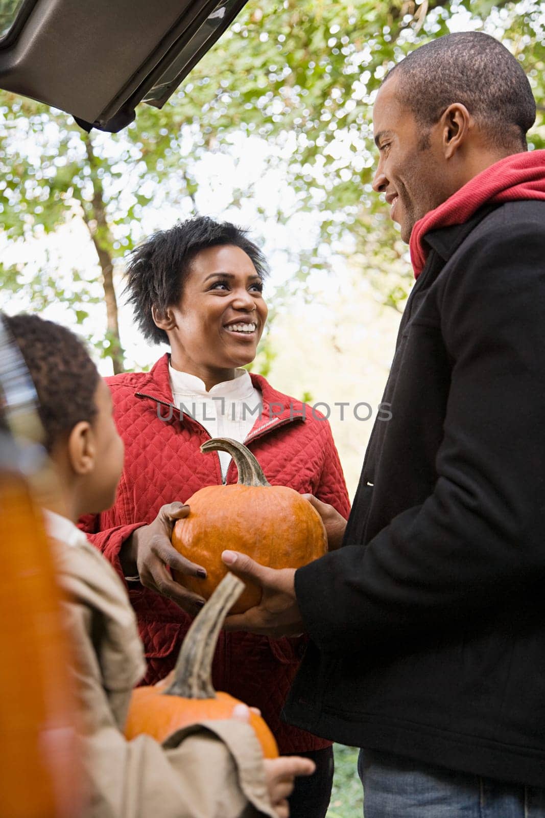 Family with pumpkins