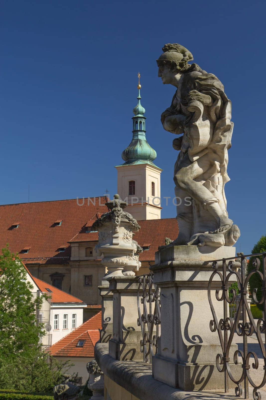 Baroque staues and famous Church of Our Lady of Victory in the background. View from Vrtbovska Garden (Prague)
