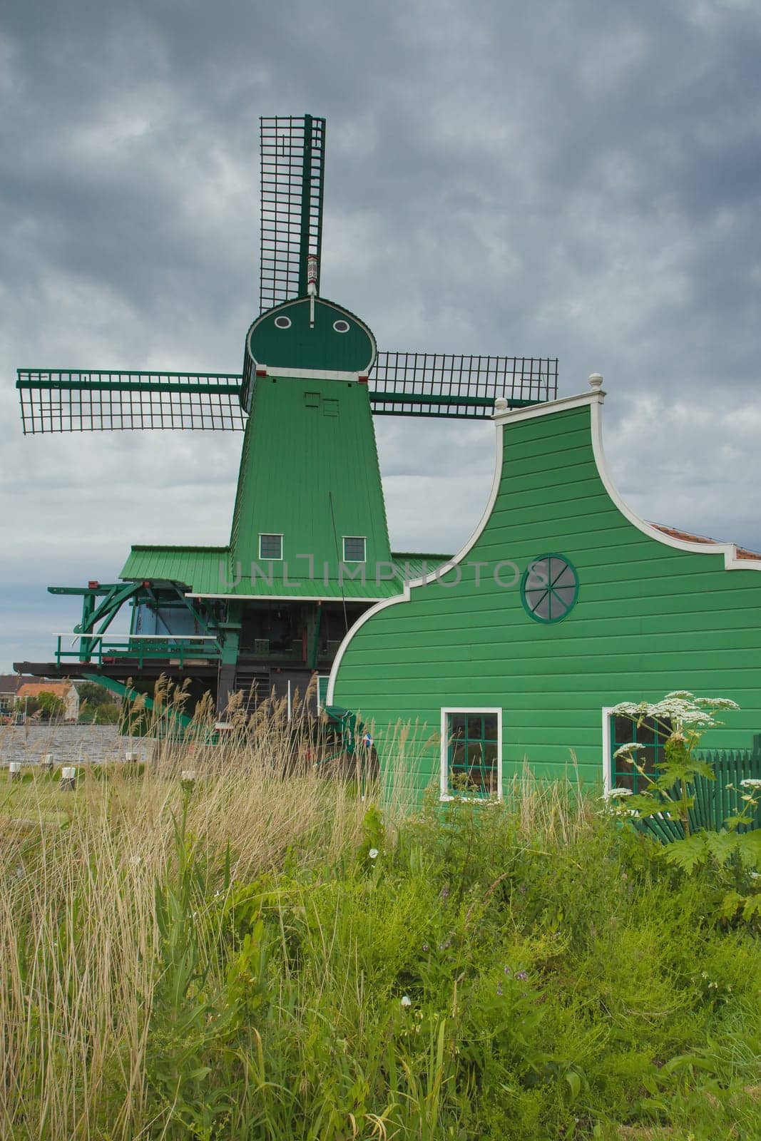 Traditional Dutch windmill in Zaanse Schans (Netherlands). Vertically.