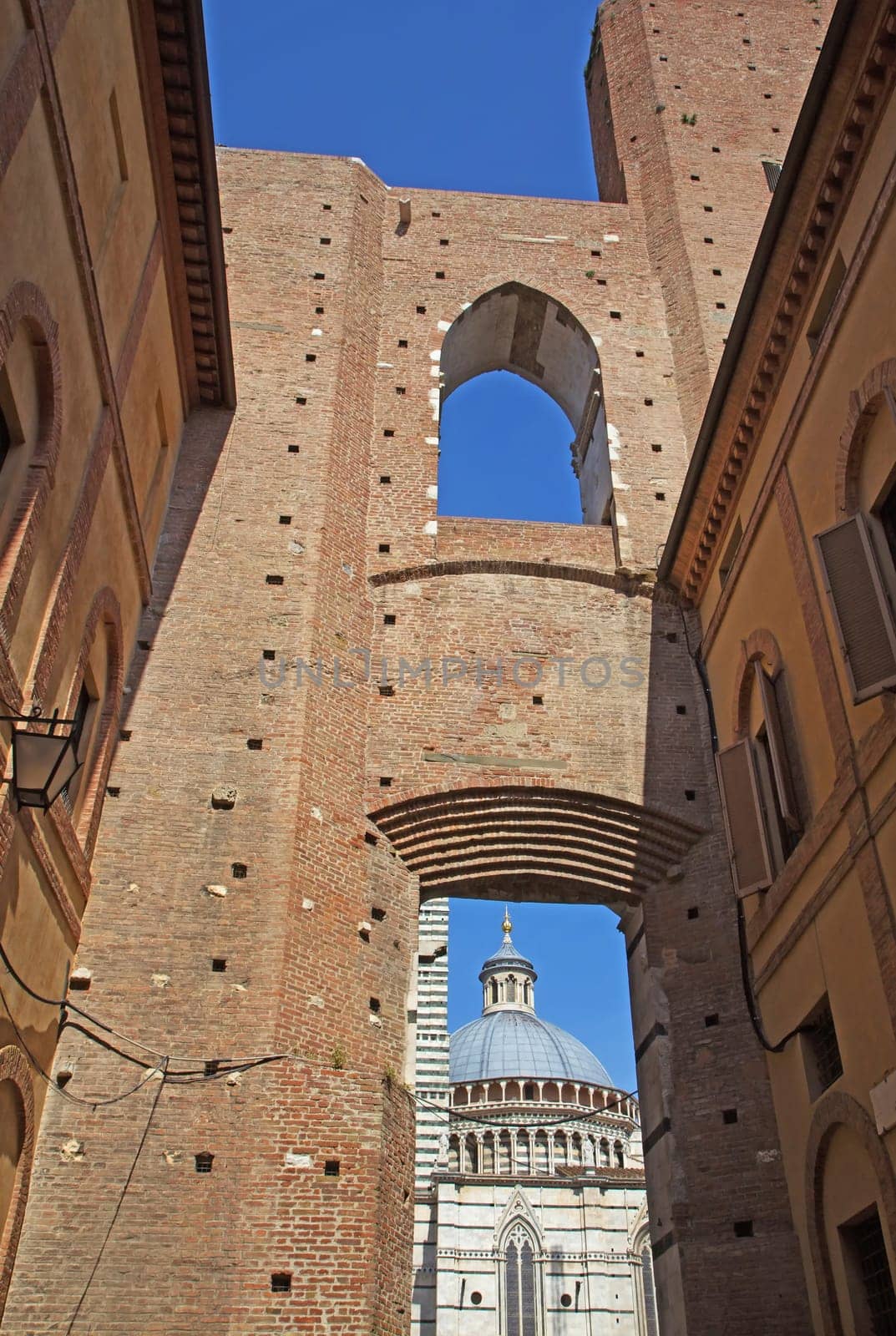 The ancient center of Siena. Famous Cathedral of Siena in the background.