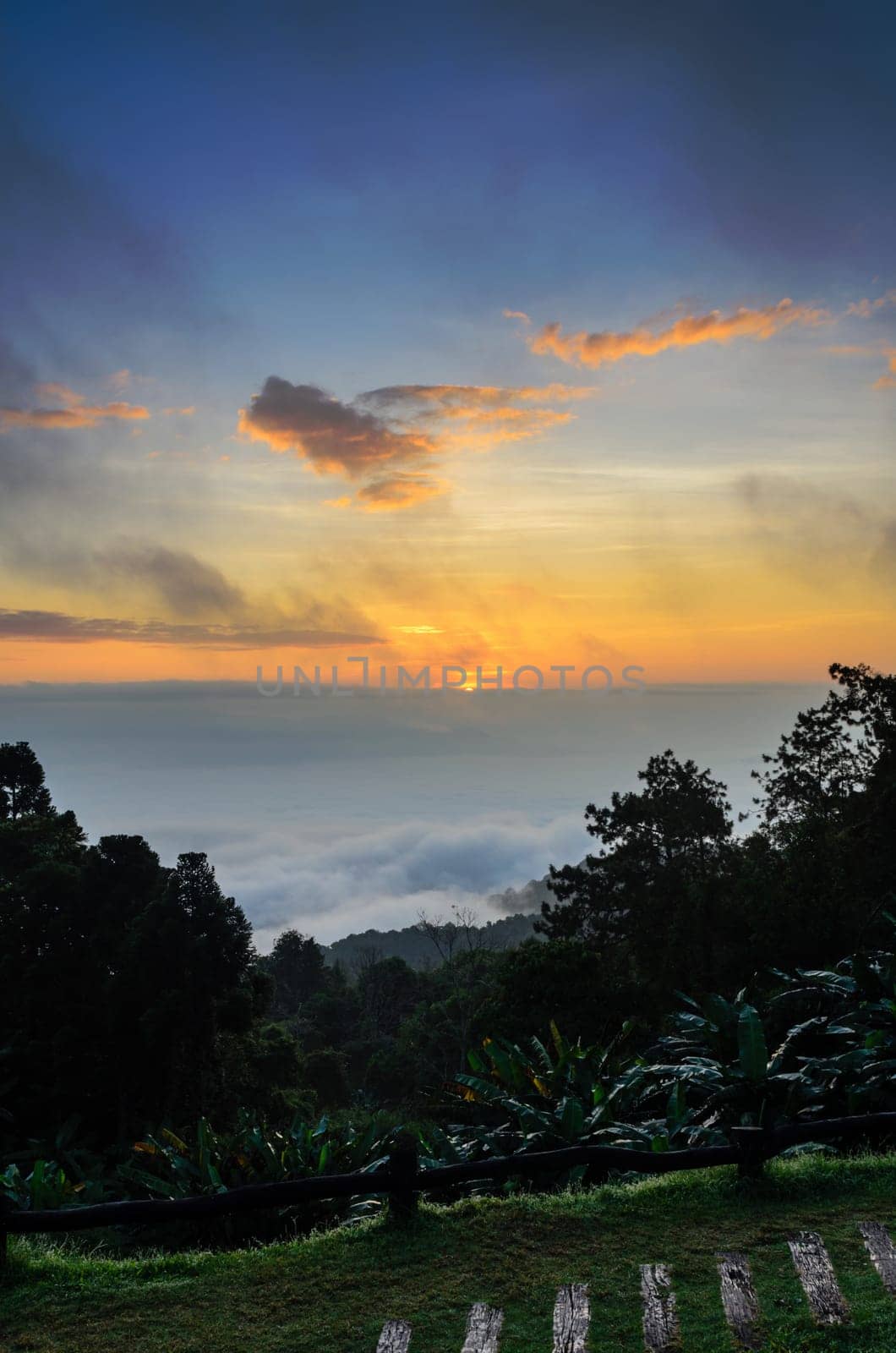 Colorful sunrise above the clouds from high mountain at viewpoint Huai Nam Dang national park in Chiang Mai and Mae Hong Son province of Thailand