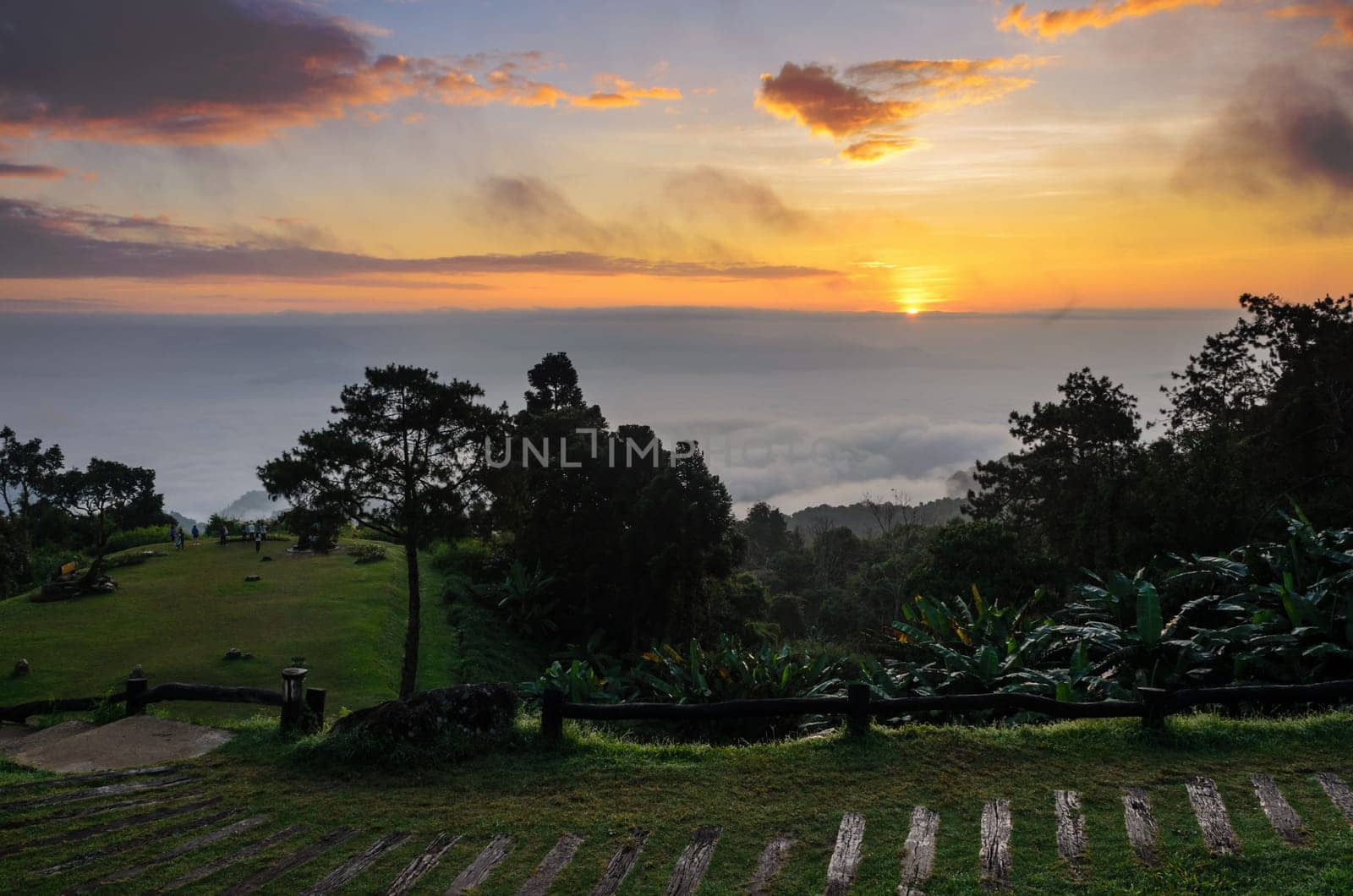 Colorful sunrise above the clouds from high mountain at viewpoint Huai Nam Dang national park in Chiang Mai and Mae Hong Son province of Thailand