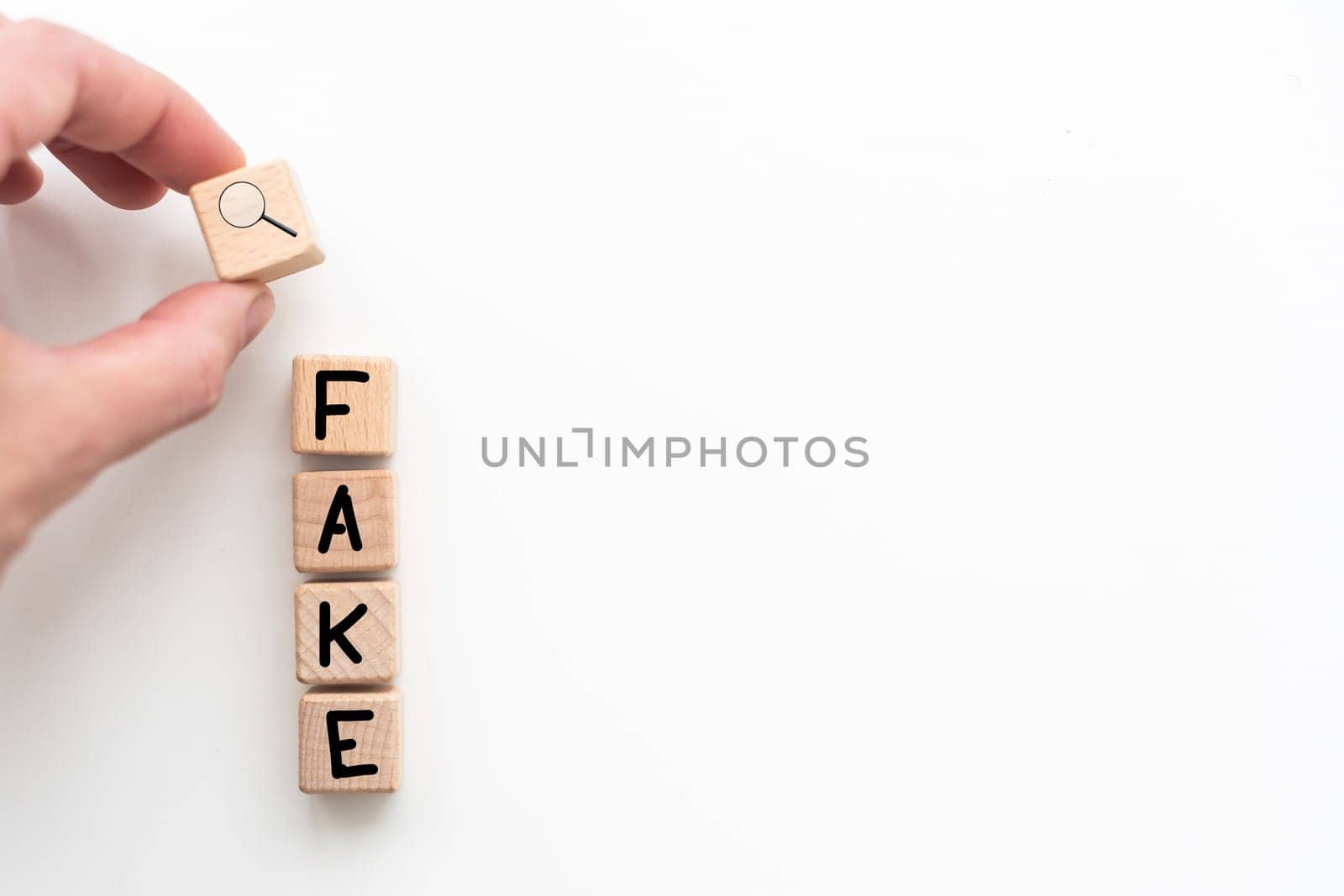 Fake news symbol. Wooden blocks with concept words Fake news on beautiful background from dollar bills. Business media and fake news concept. Copy space. High quality photo