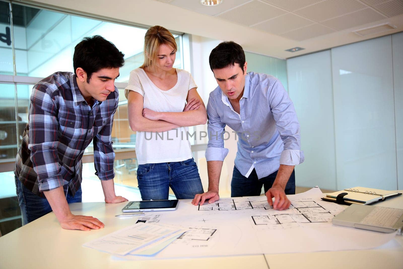 Team of architects working on construction plans