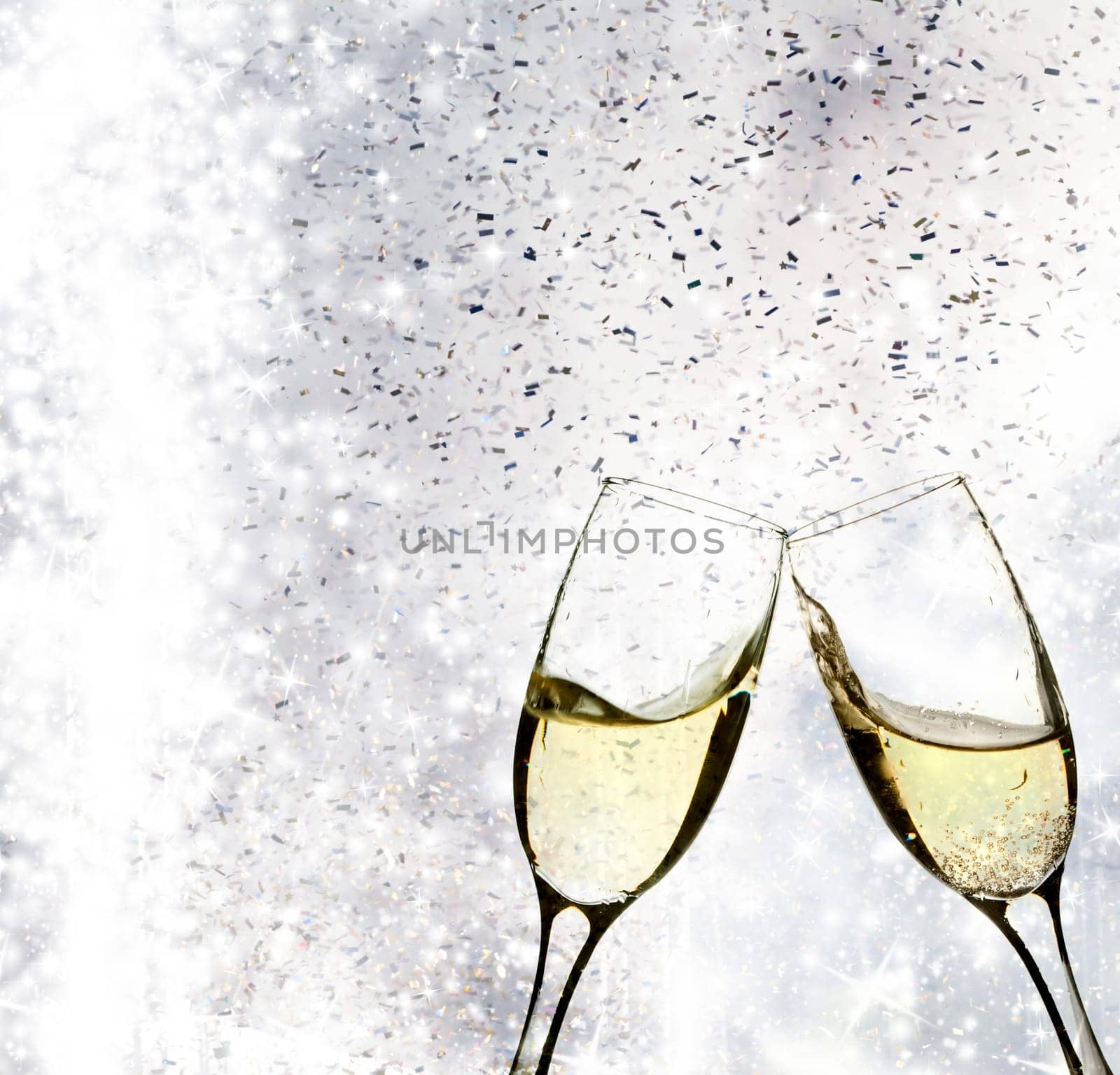 Champangne glasses on sparkling background
