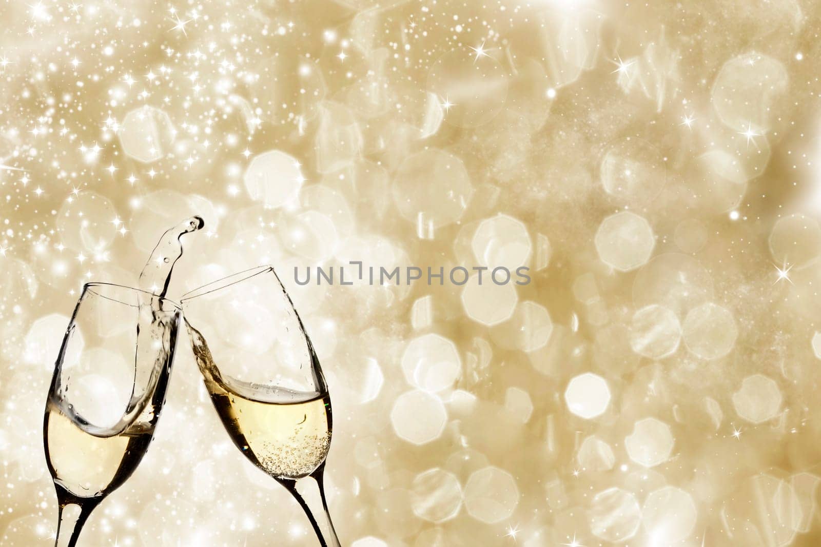 Champangne glasses on sparkling background