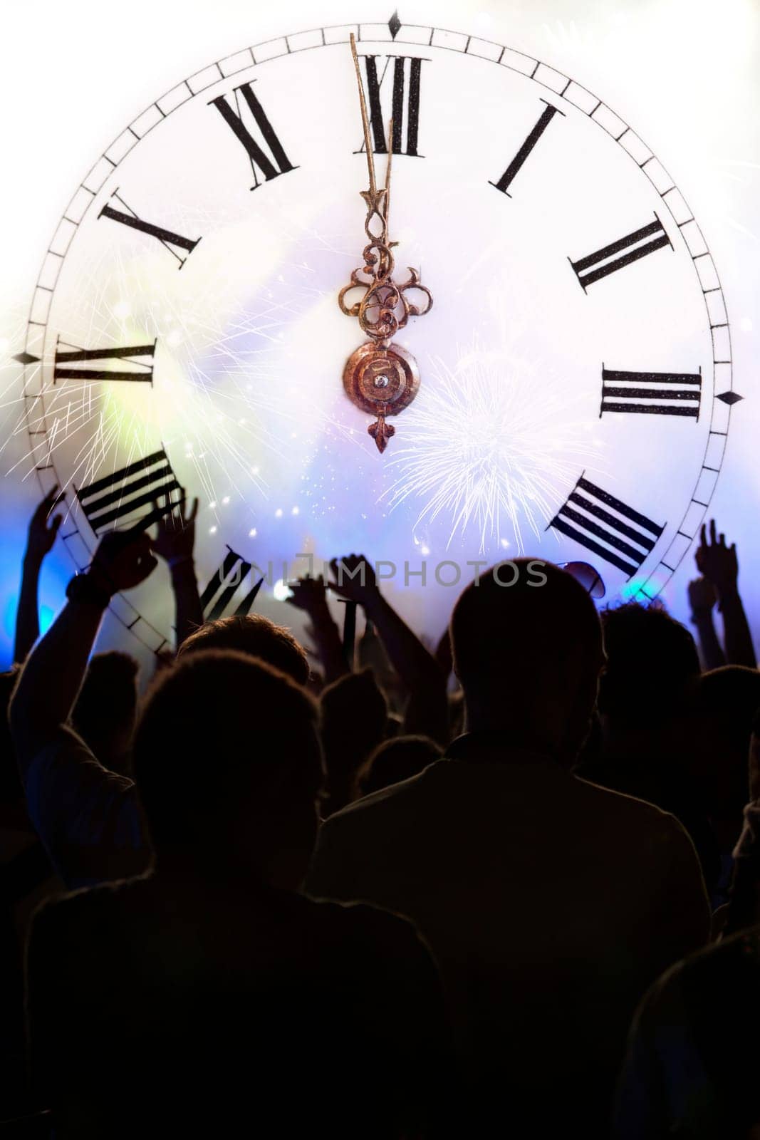 Clock close to midnight, fireworks and crowd waiting for New year