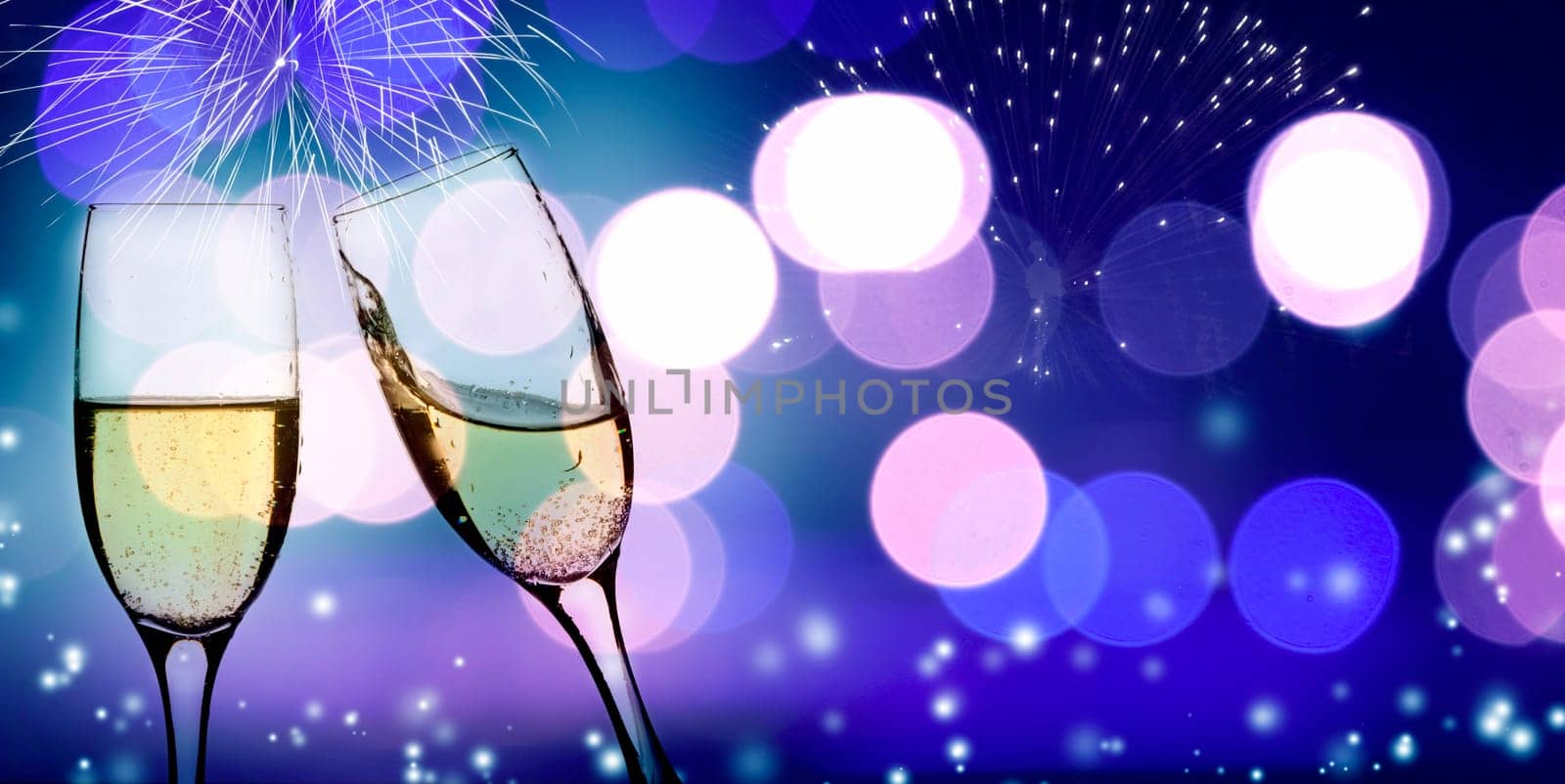 Champangne glasses on sparkling background