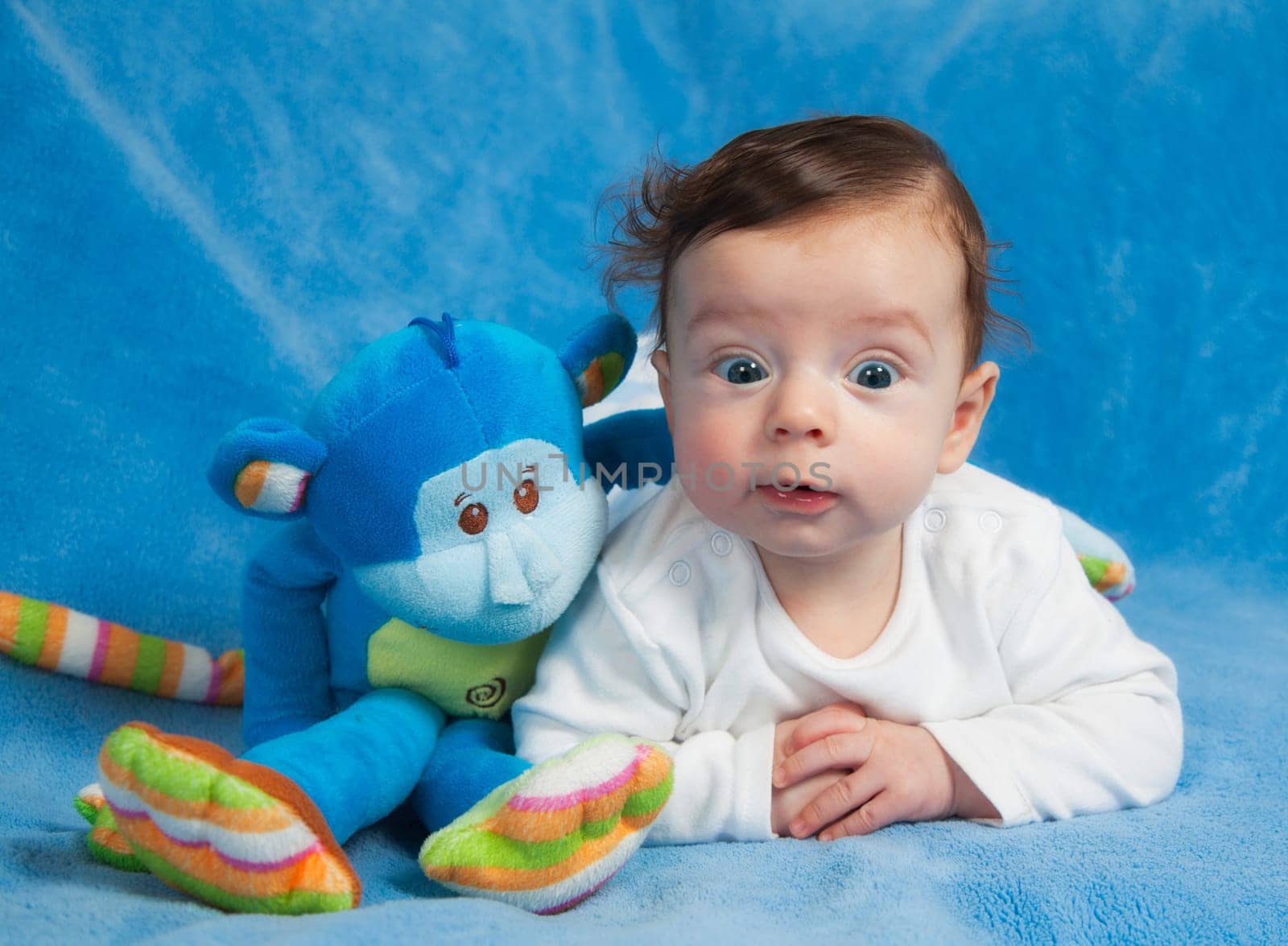 Portrait of 4 months old baby boy at home.