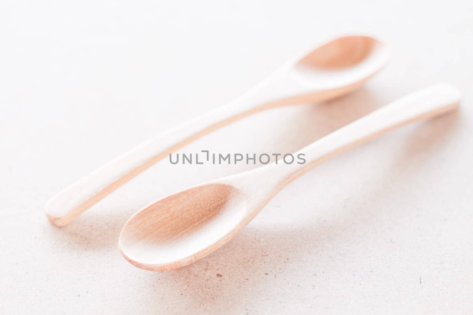 Wooden spoons on wooden background, stock photo