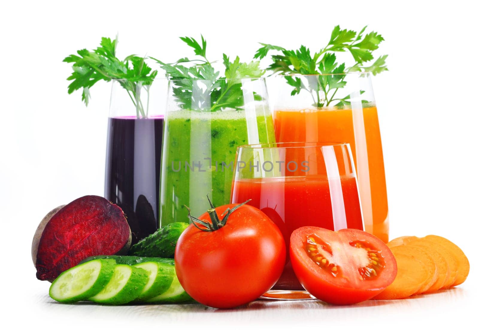 Glasses with fresh vegetable juices isolated on white. Detox diet.