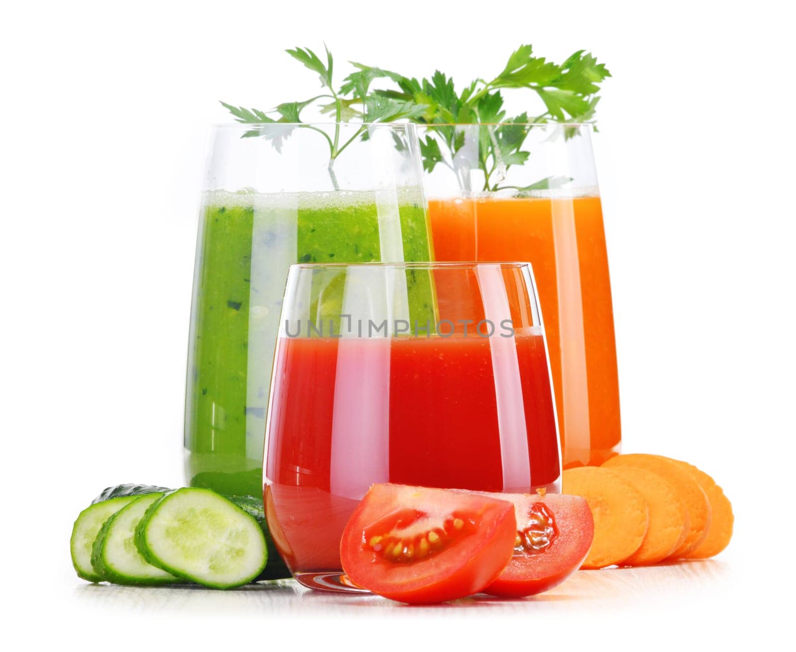 Glasses with fresh vegetable juices isolated on white. Detox diet.
