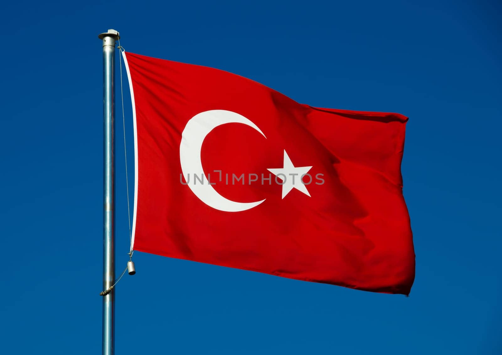 Turkish national flag over blue sky