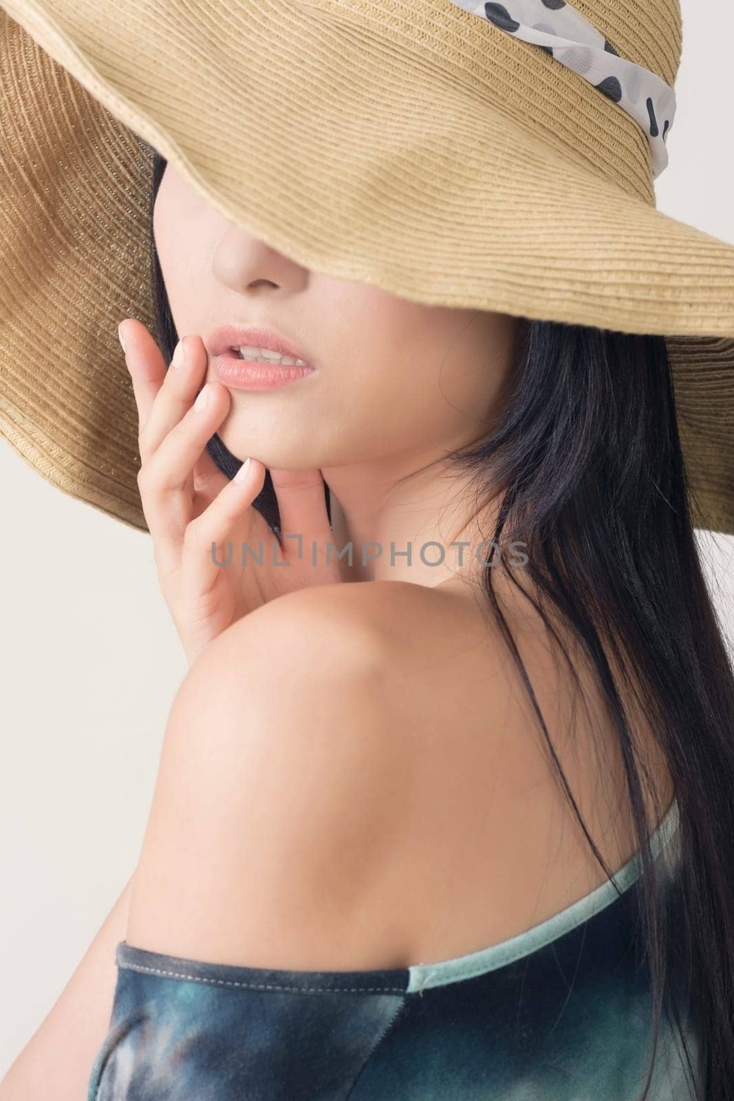 Glamour of Asian beauty with hat, closeup portrait.
