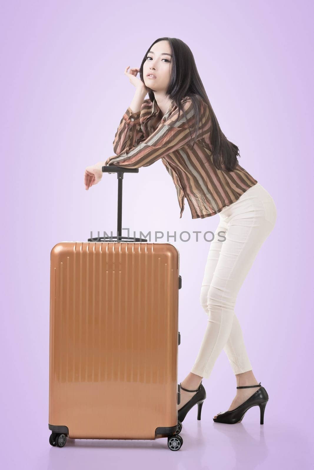 Modern Asian woman stand with a luggage.