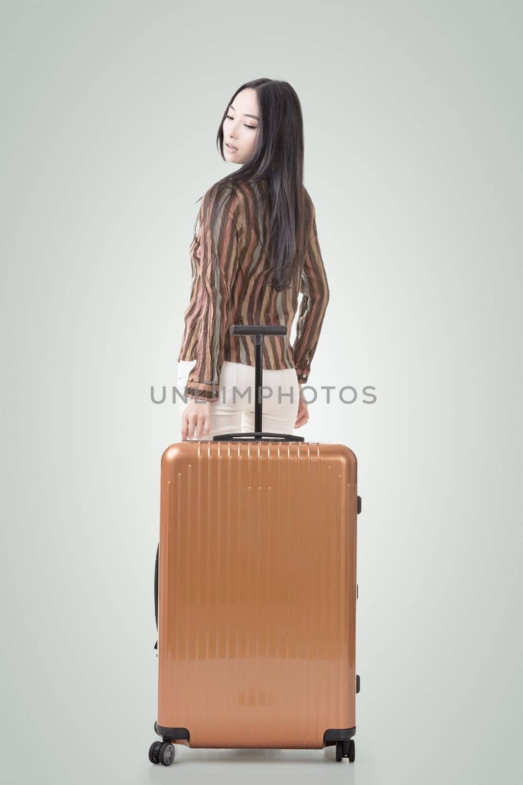 Modern Asian woman stand with a luggage.