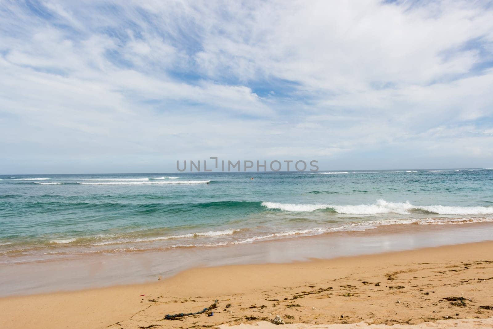 Beautiful secluded sandy beach in the Caribbean with white sand and blue sky as in paradise