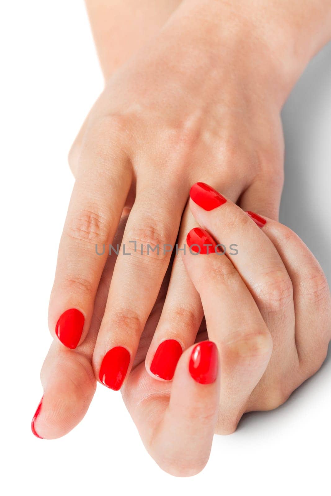 Women's hands with beautiful well-groomed fingers and red nail polish wellness beauty spa close up isolated on white background