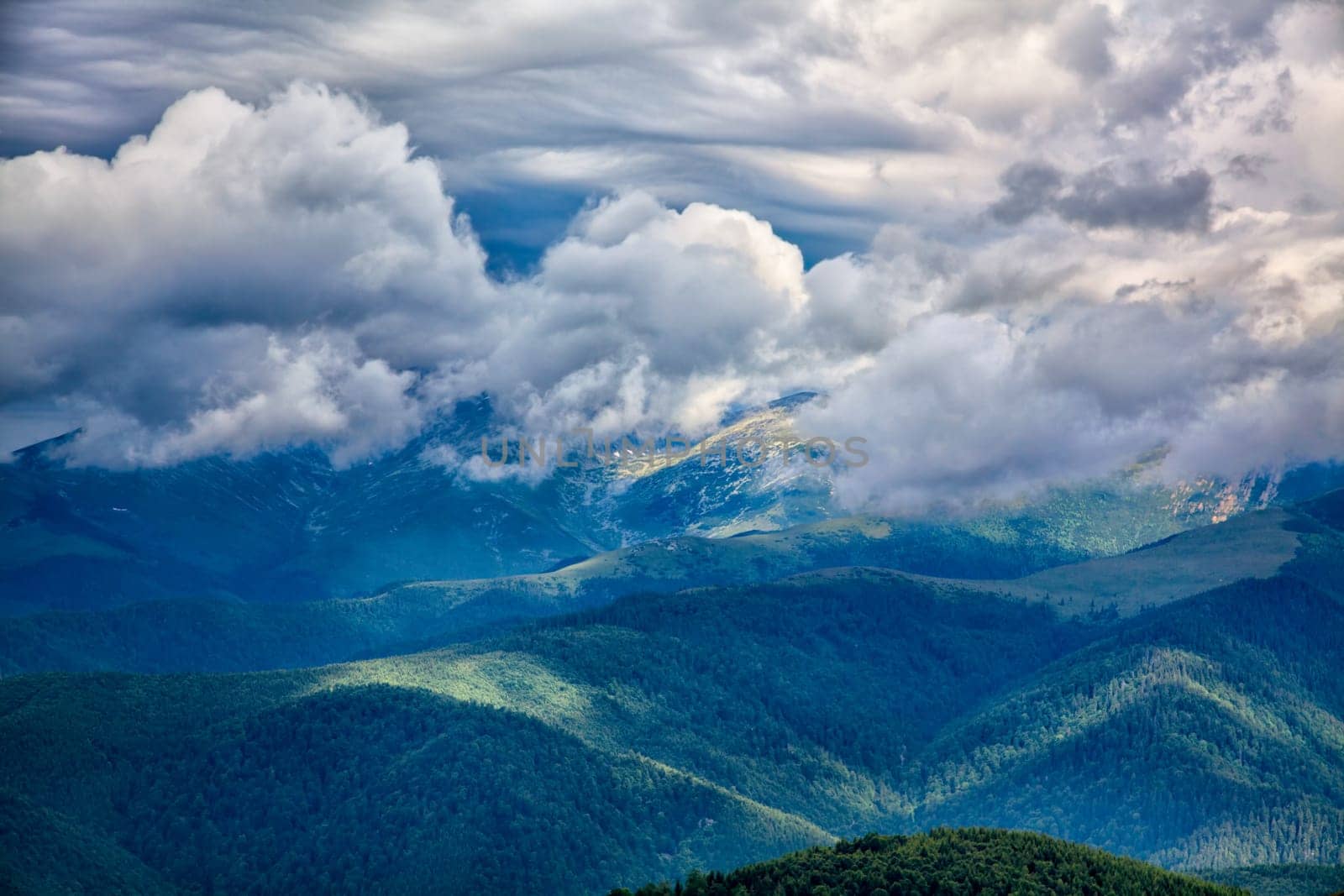 Cloudy landscape of the alpine area seen from the Transalpina road in Romania.