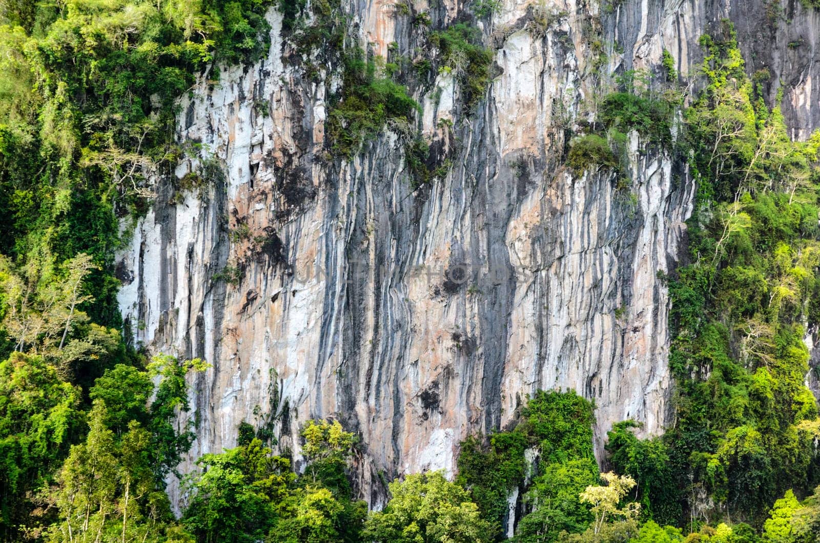 Stripes of rock cliff on limestone mountain