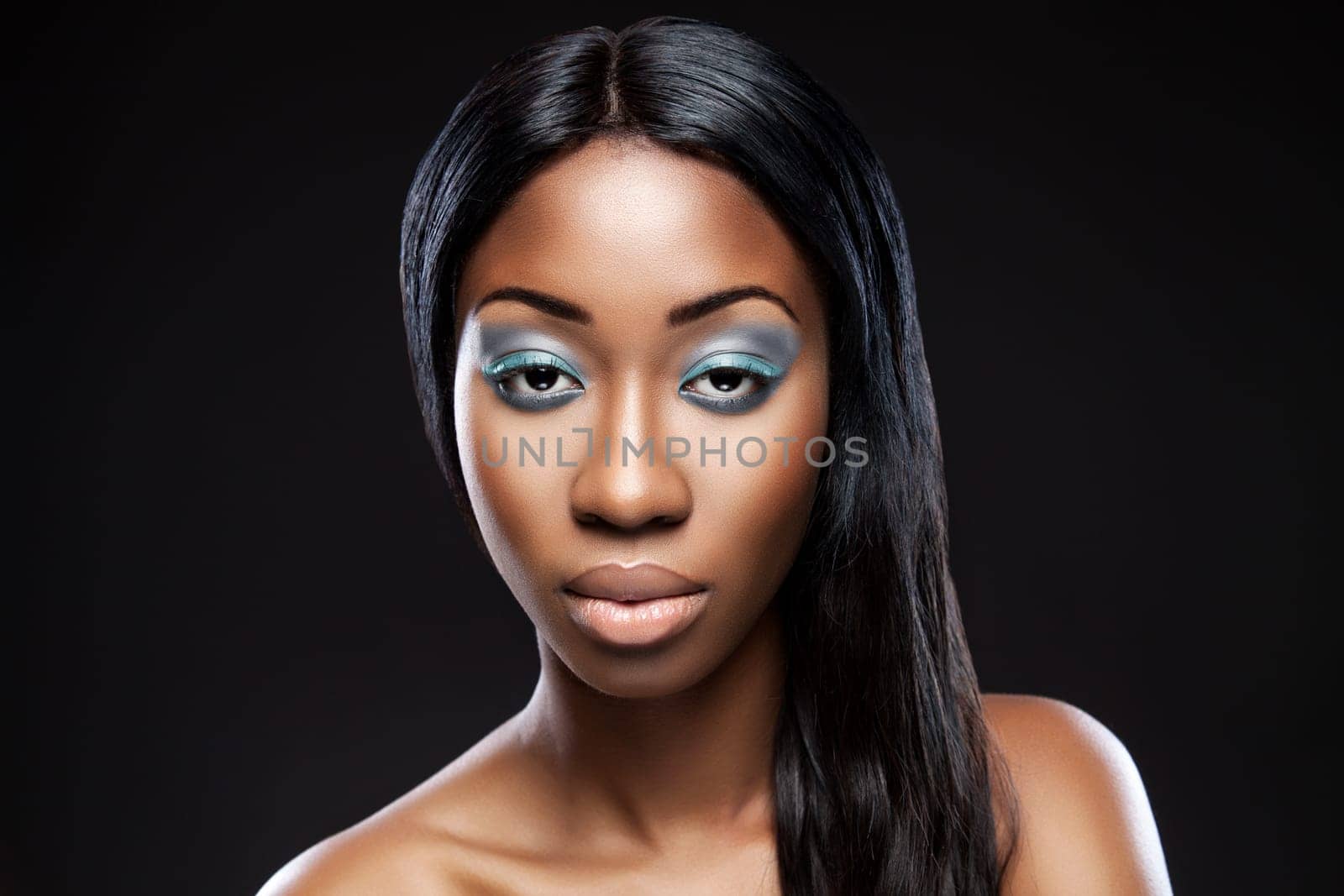 Beautiful young black woman with makeup and long hair