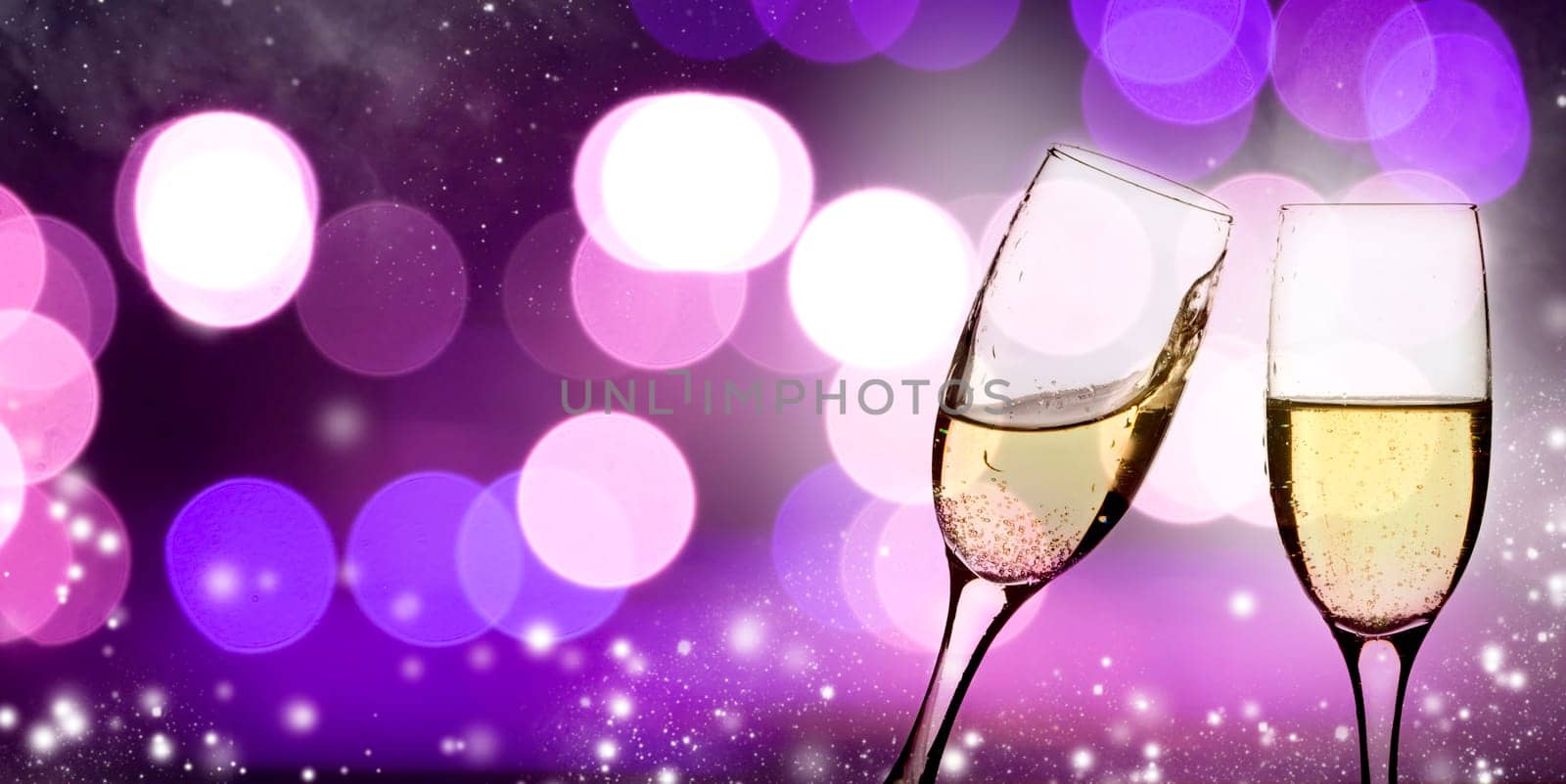 Champangne glasses on sparkling background