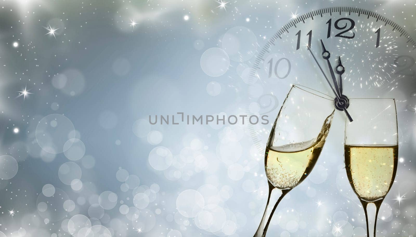 Glasses with champagne against holiday lights and clock close to midnight