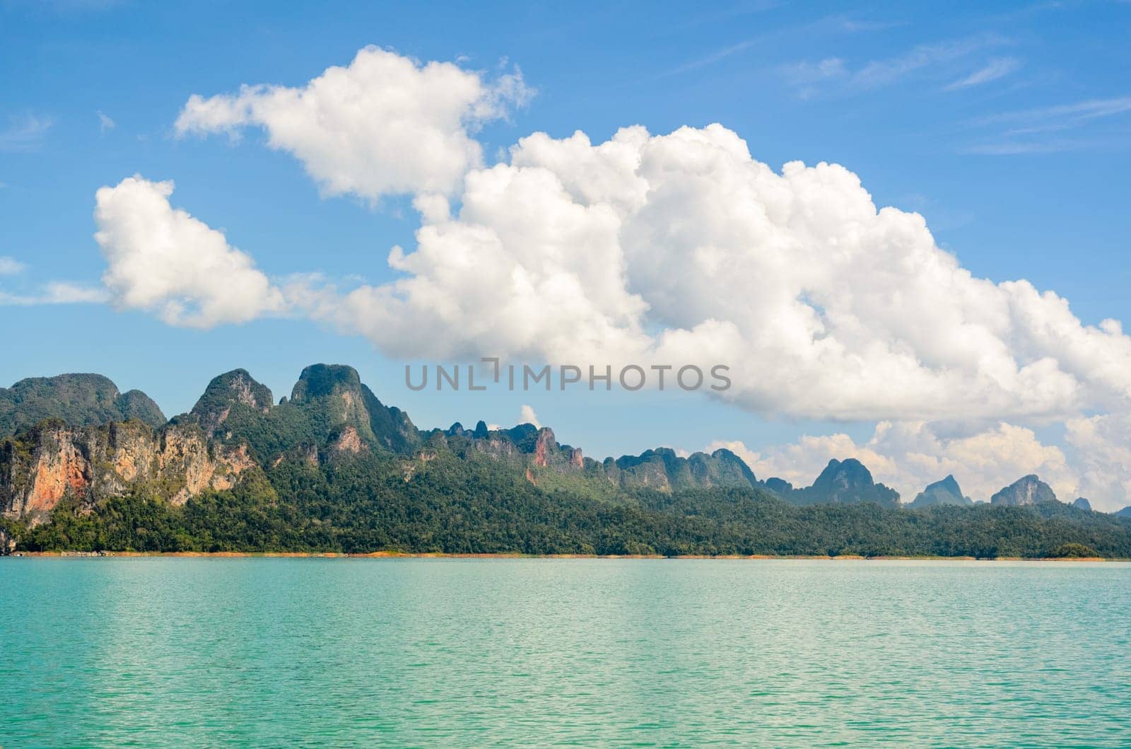 High mountain range above the green lake at Ratchapapha dam in Khao Sok National Park, Surat Thani province, Guilin of Thailand.