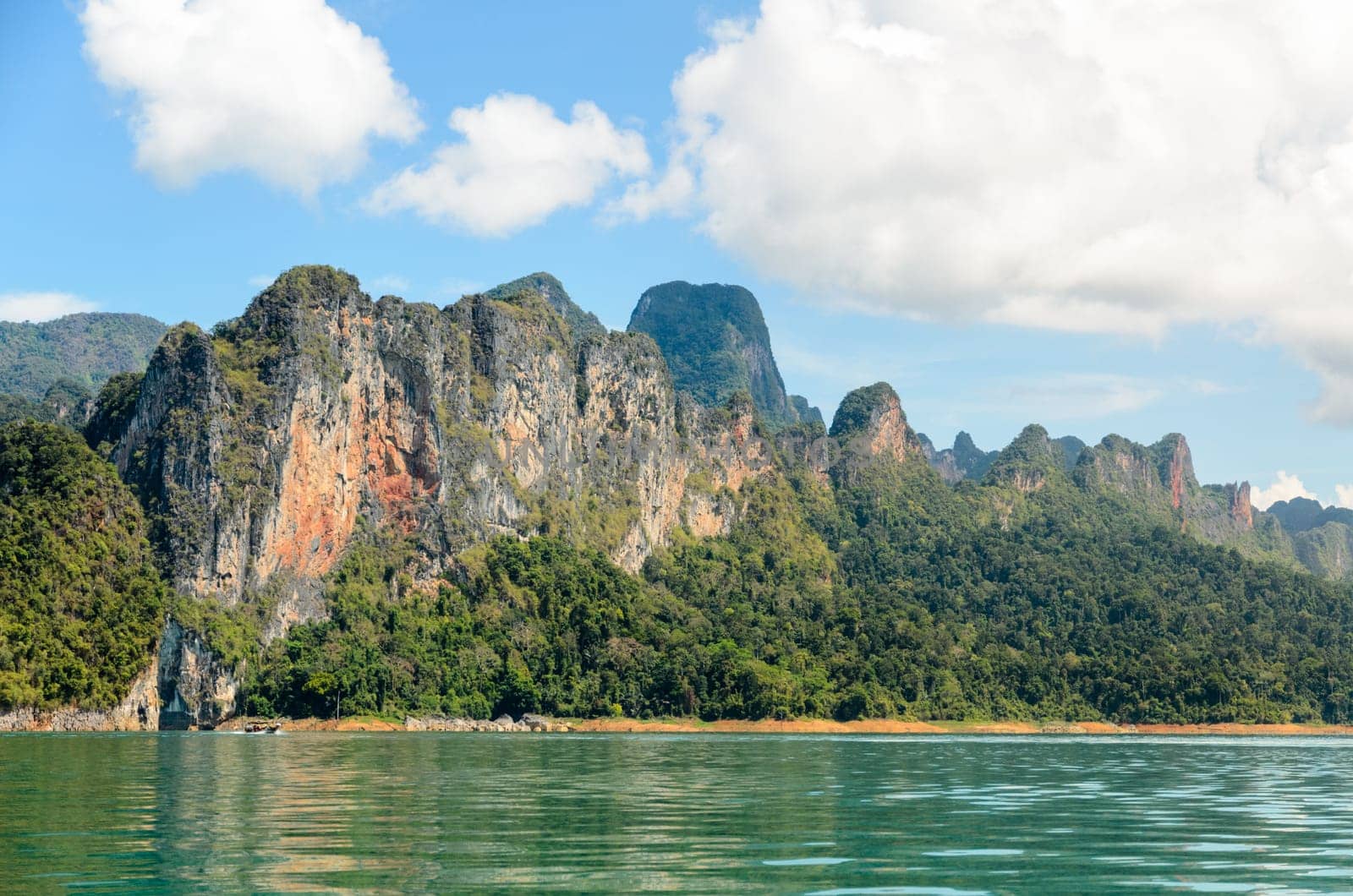 High mountain range above the green lake at Ratchapapha dam in Khao Sok National Park, Surat Thani province, Guilin of Thailand.