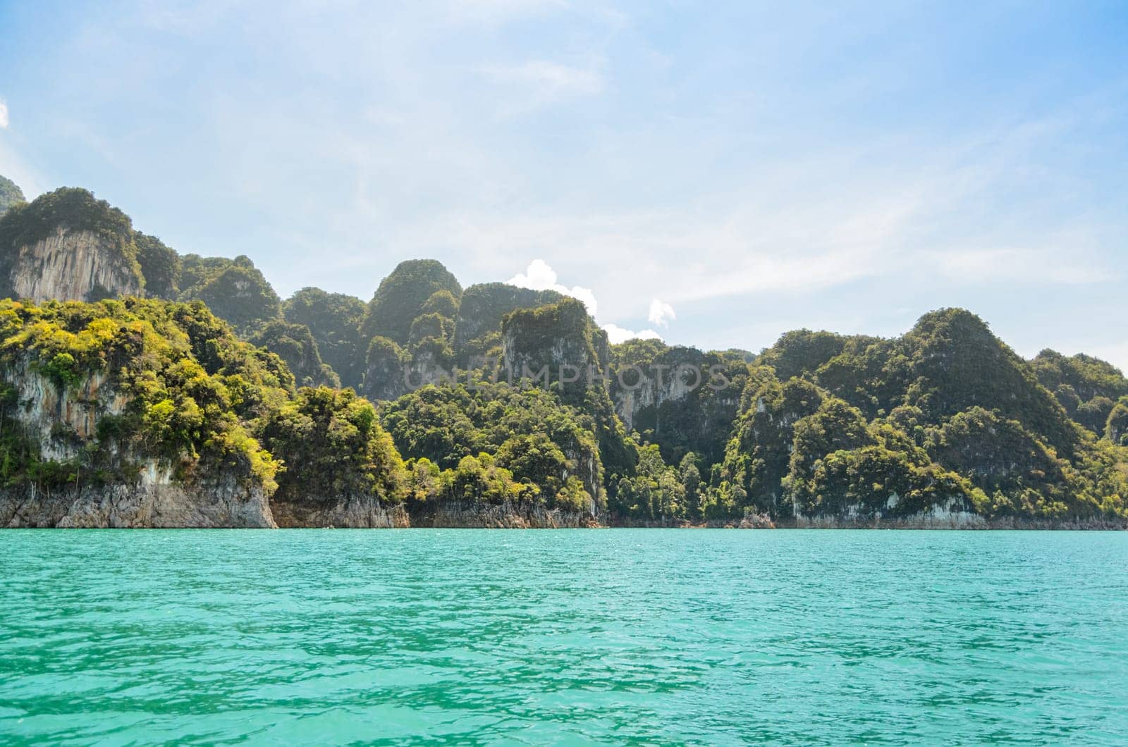 High mountain range above the green lake at Ratchapapha dam in Khao Sok National Park, Surat Thani province, Guilin of Thailand.