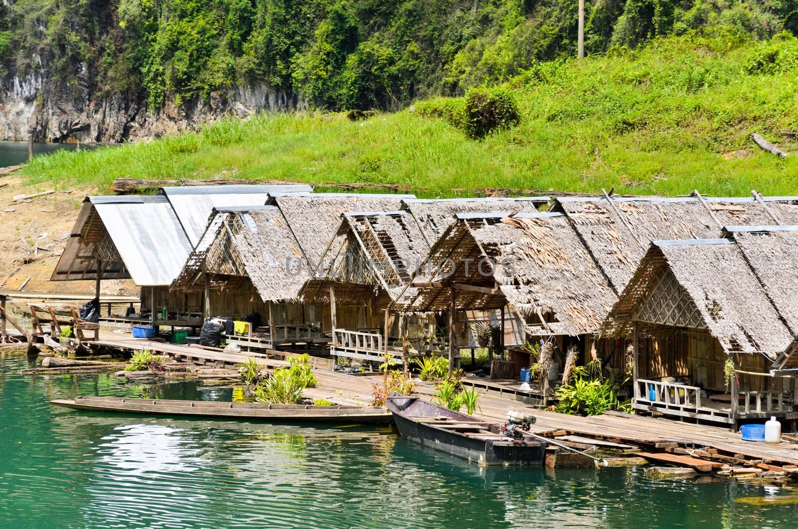 Floating home of the forest staff, Motor raft wharf in Ratchaprapha Dam at Khao Sok National Park, Surat Thani, Thailand