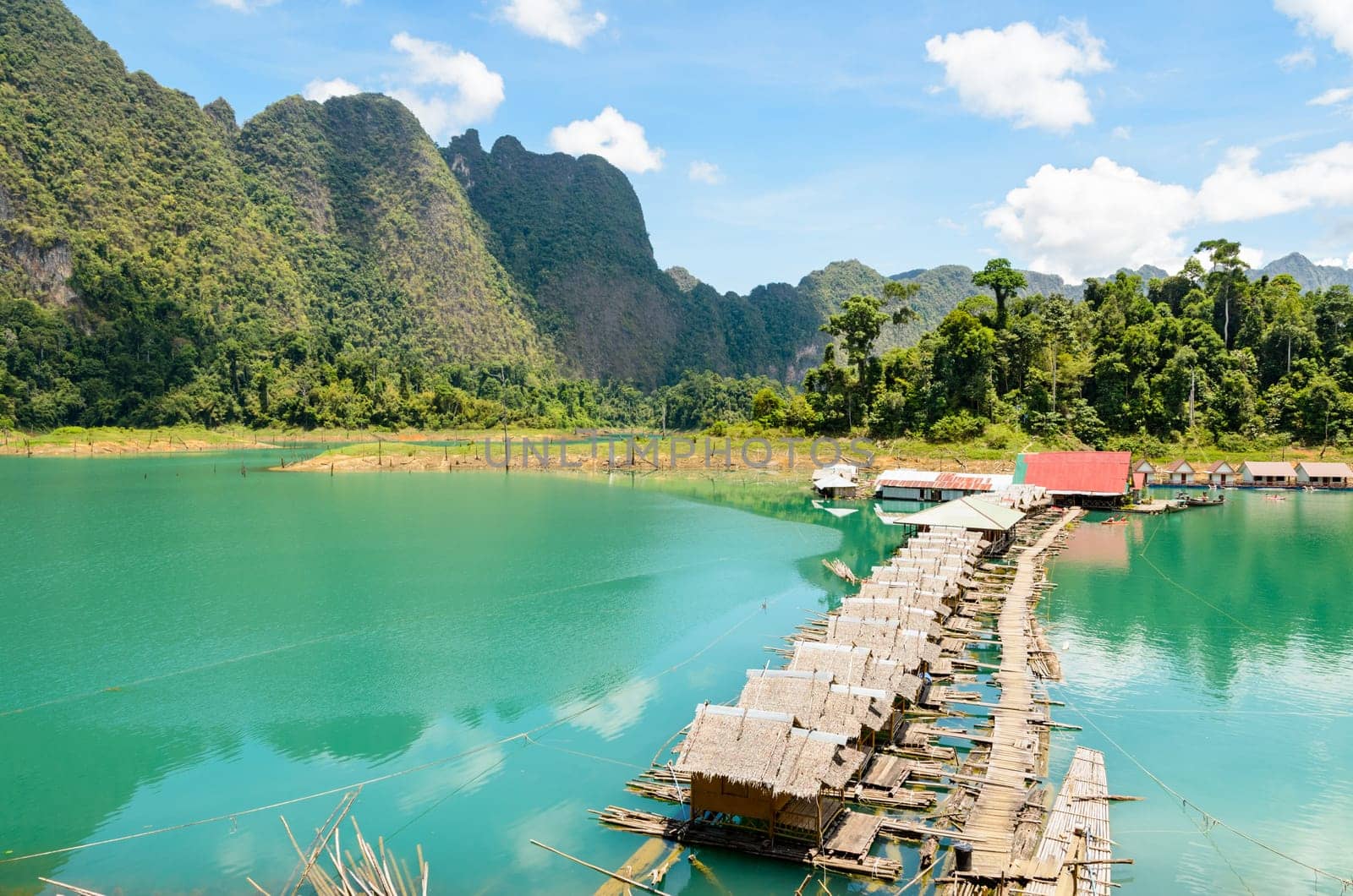 Small bungalow made of bamboo floating. Surrounded by mountains and water in Ratchaprapha Dam, Khao Sok National Park, Surat Thani Province, Thailand.