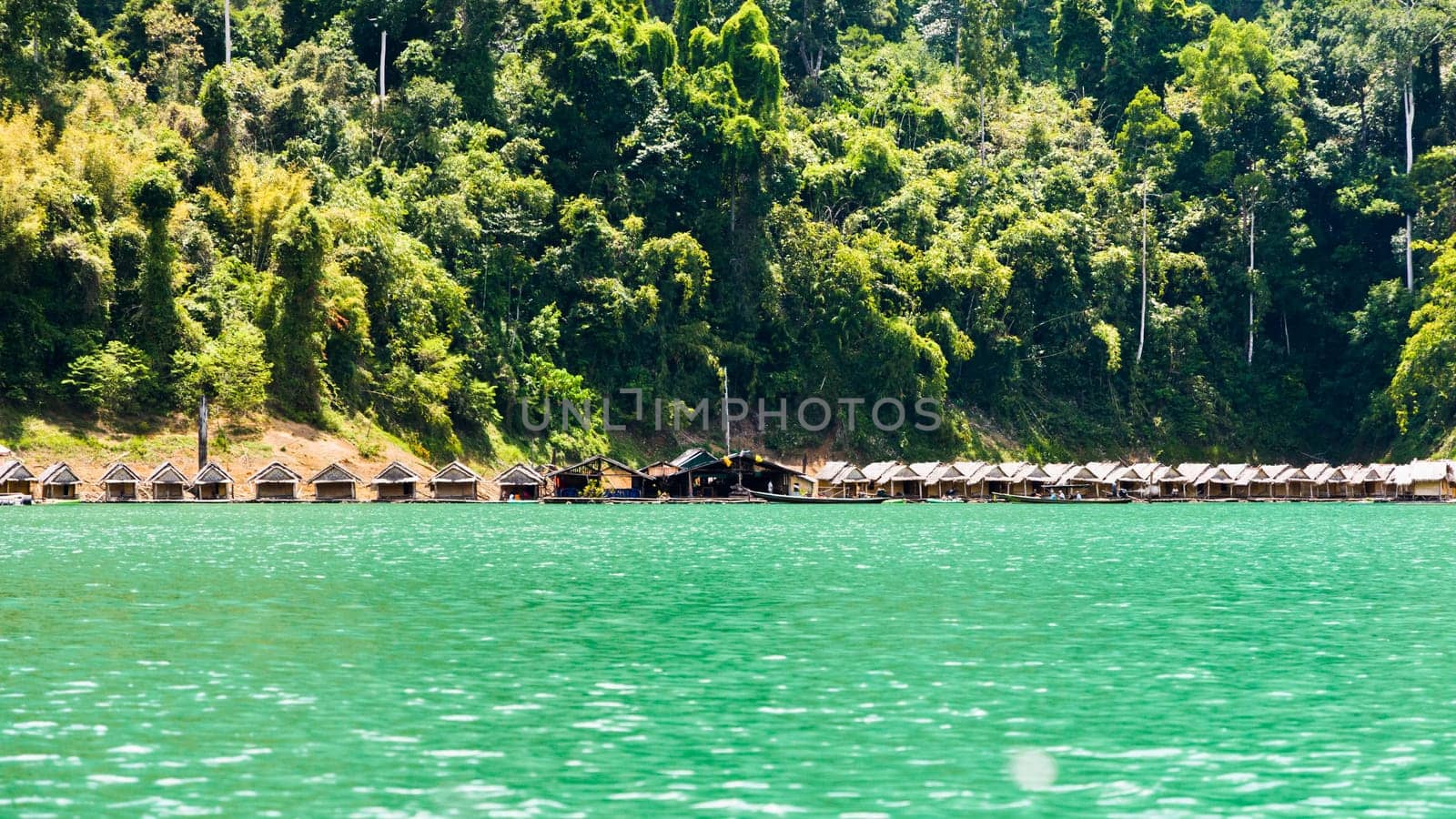 Small bungalow made of bamboo floating. Surrounded by mountains and water in Ratchaprapha Dam, Khao Sok National Park, Surat Thani Province, Thailand.