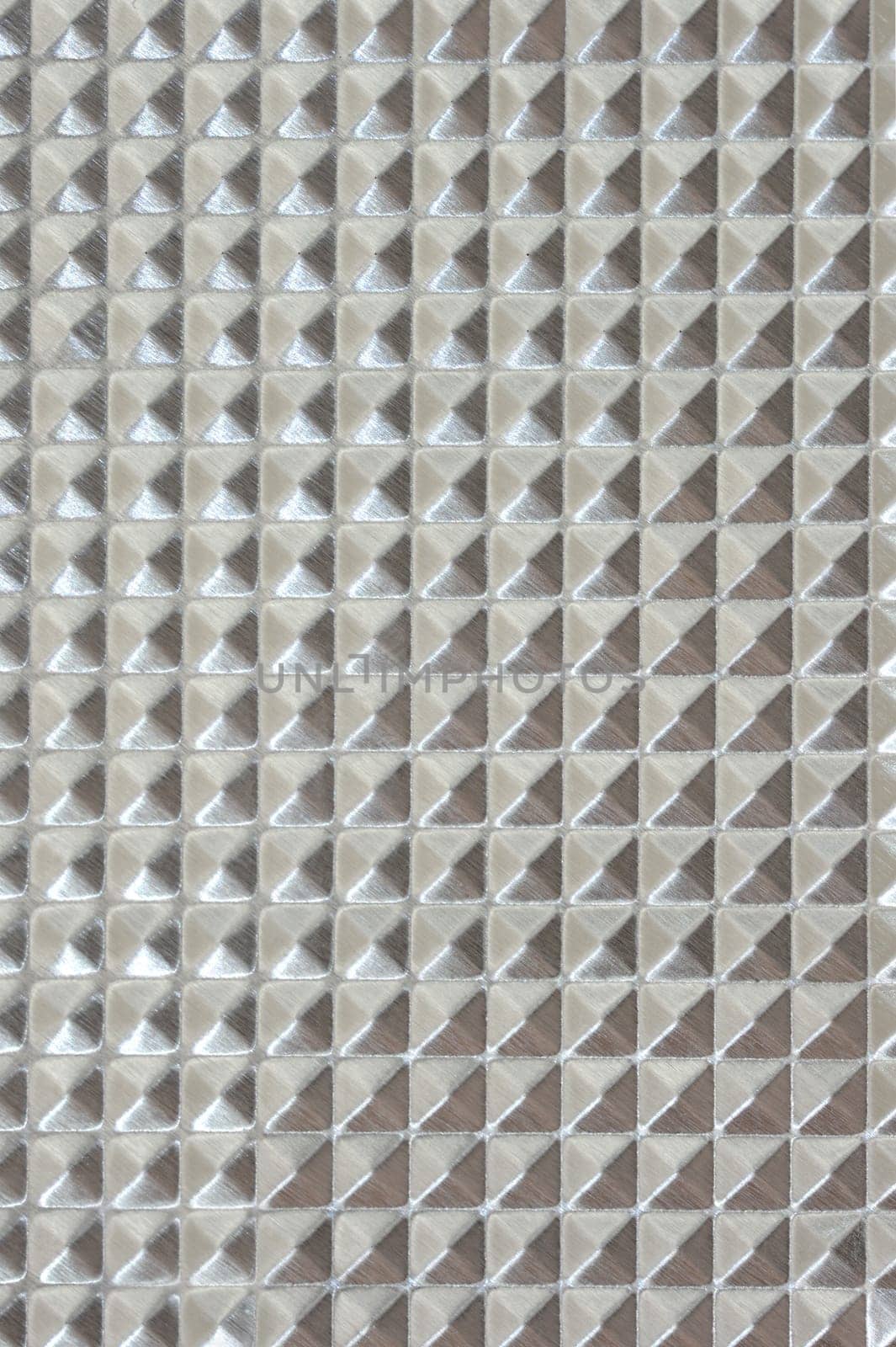A close up shot of a metal background imprint