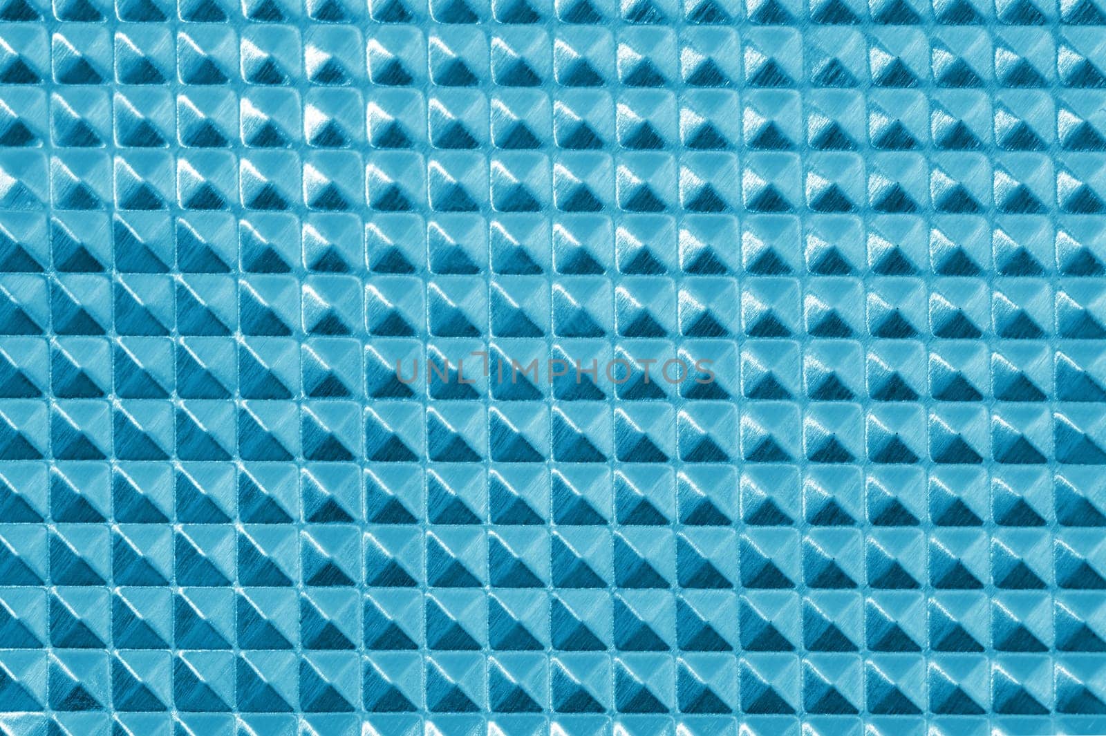A close up shot of a metal background imprint
