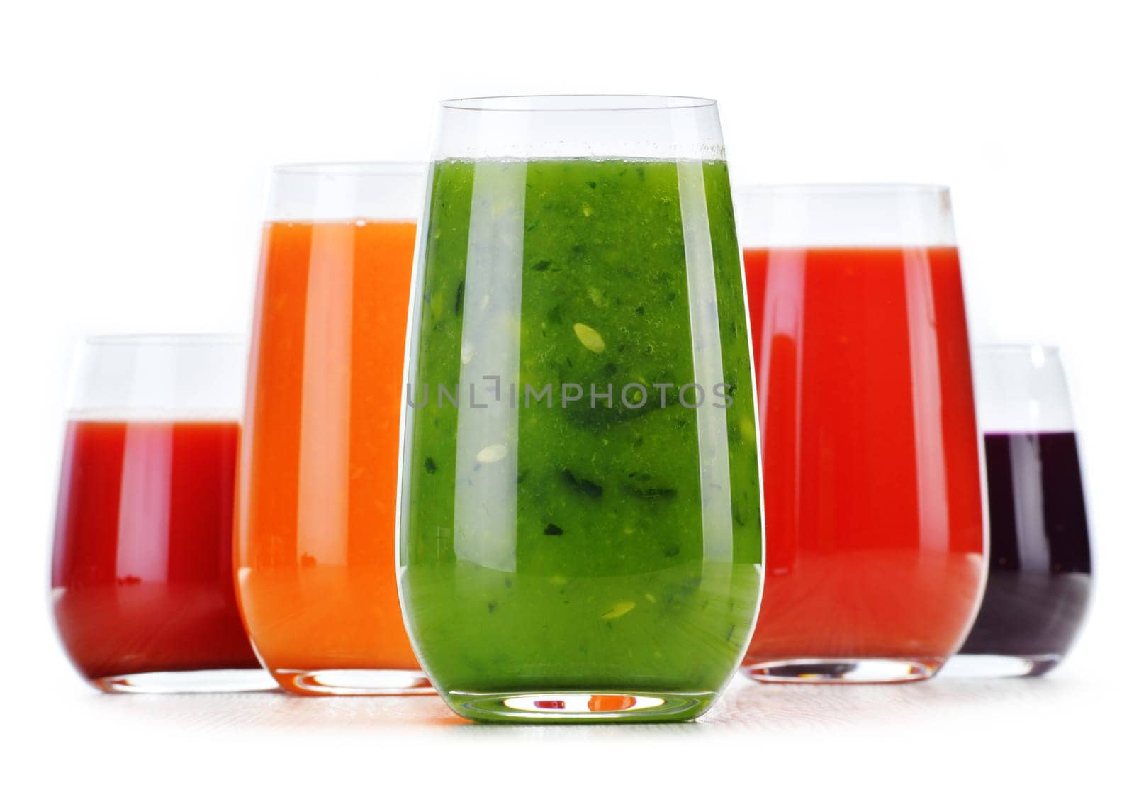 Glasses with fresh vegetable juices isolated on white. Detox diet.