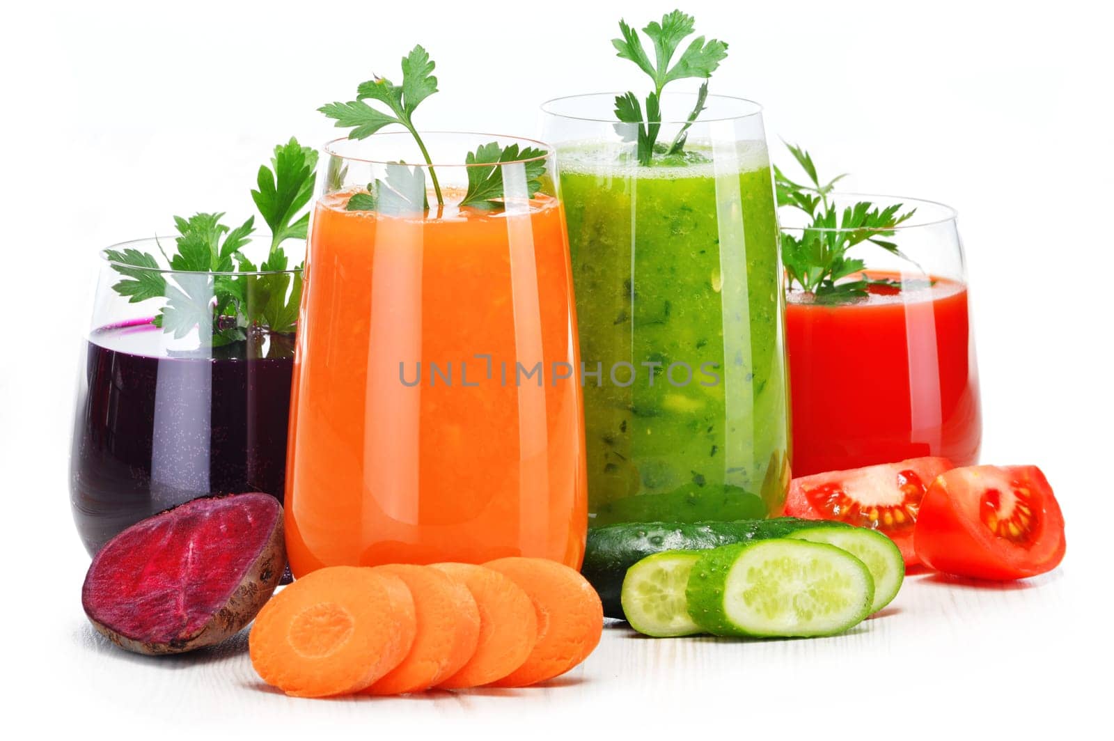 Glasses with fresh vegetable juices isolated on white. Detox diet.