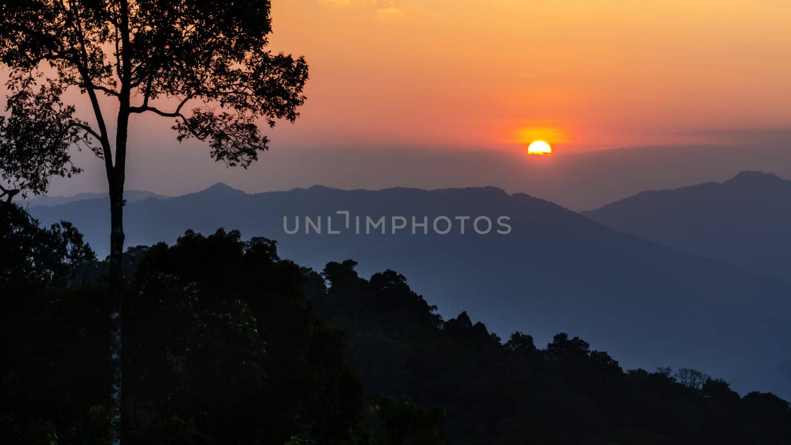 High angle view beautiful sunset over mountain range from Panoen Thung scenic point at Kaeng Krachan National Park Phetchaburi province in Thailand
