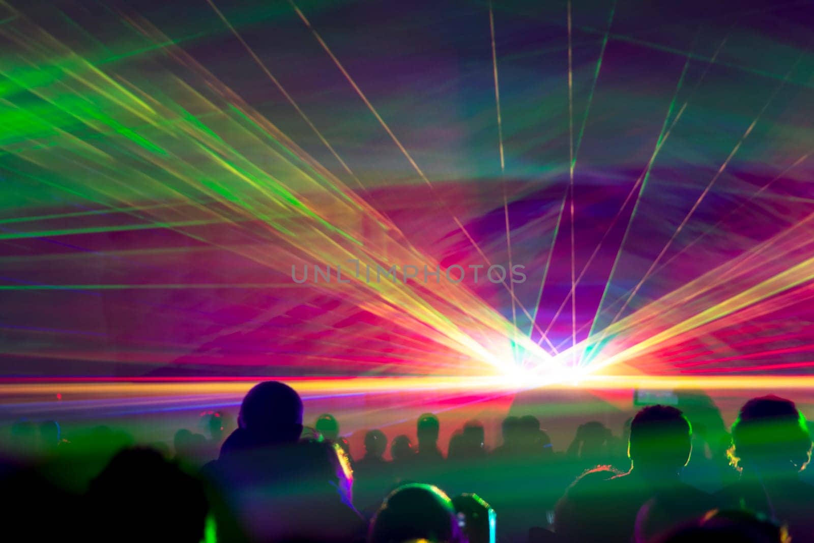 Very colorful show with a crowd silhouette and great laser rays on pyrotechnic festival in germany