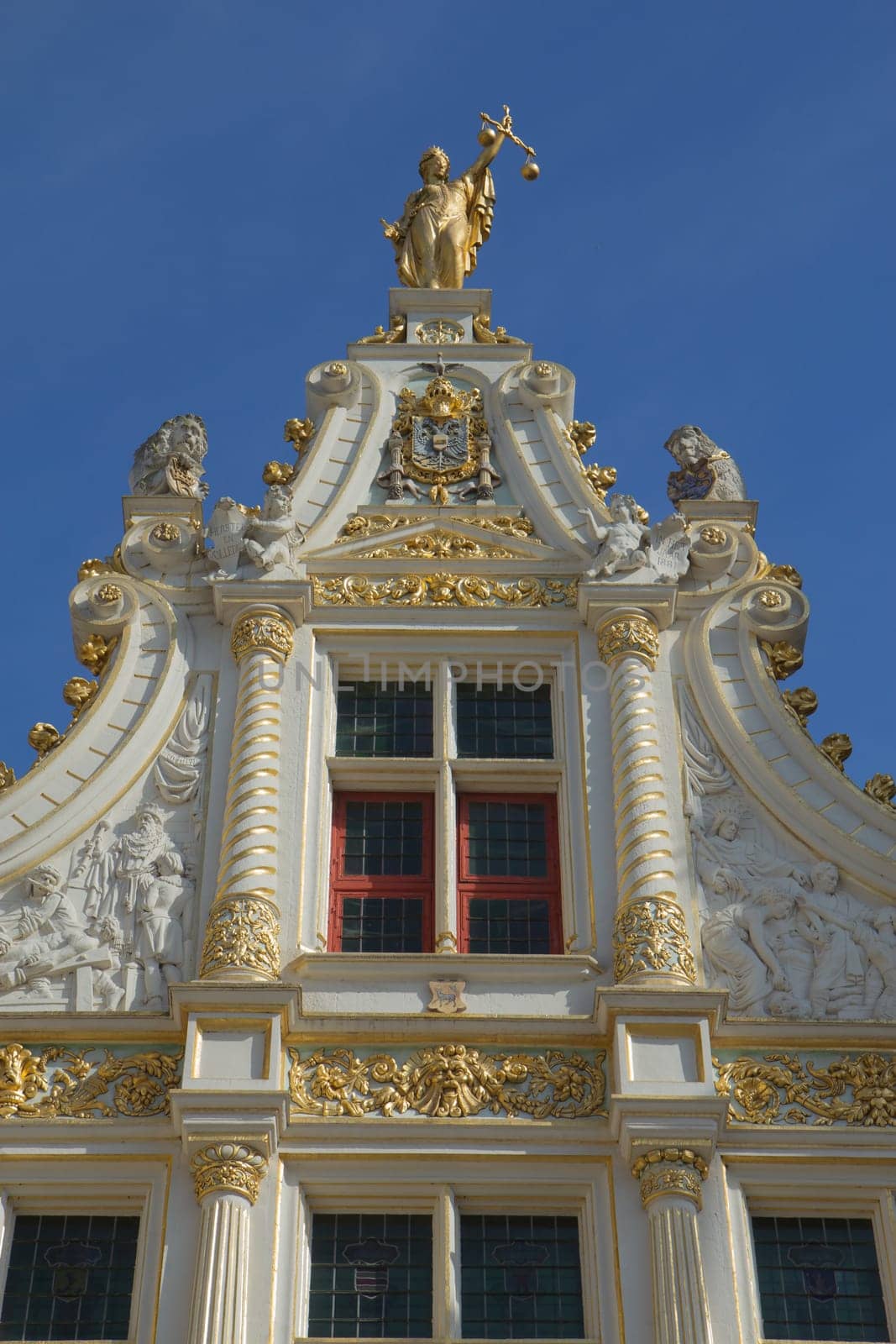 The Burg square in Bruges (Belgium) is really a showcase of different European architectural styles. Next to the gothic town hall stands the Old Civil Registry in renaissance style. (1534-1537).