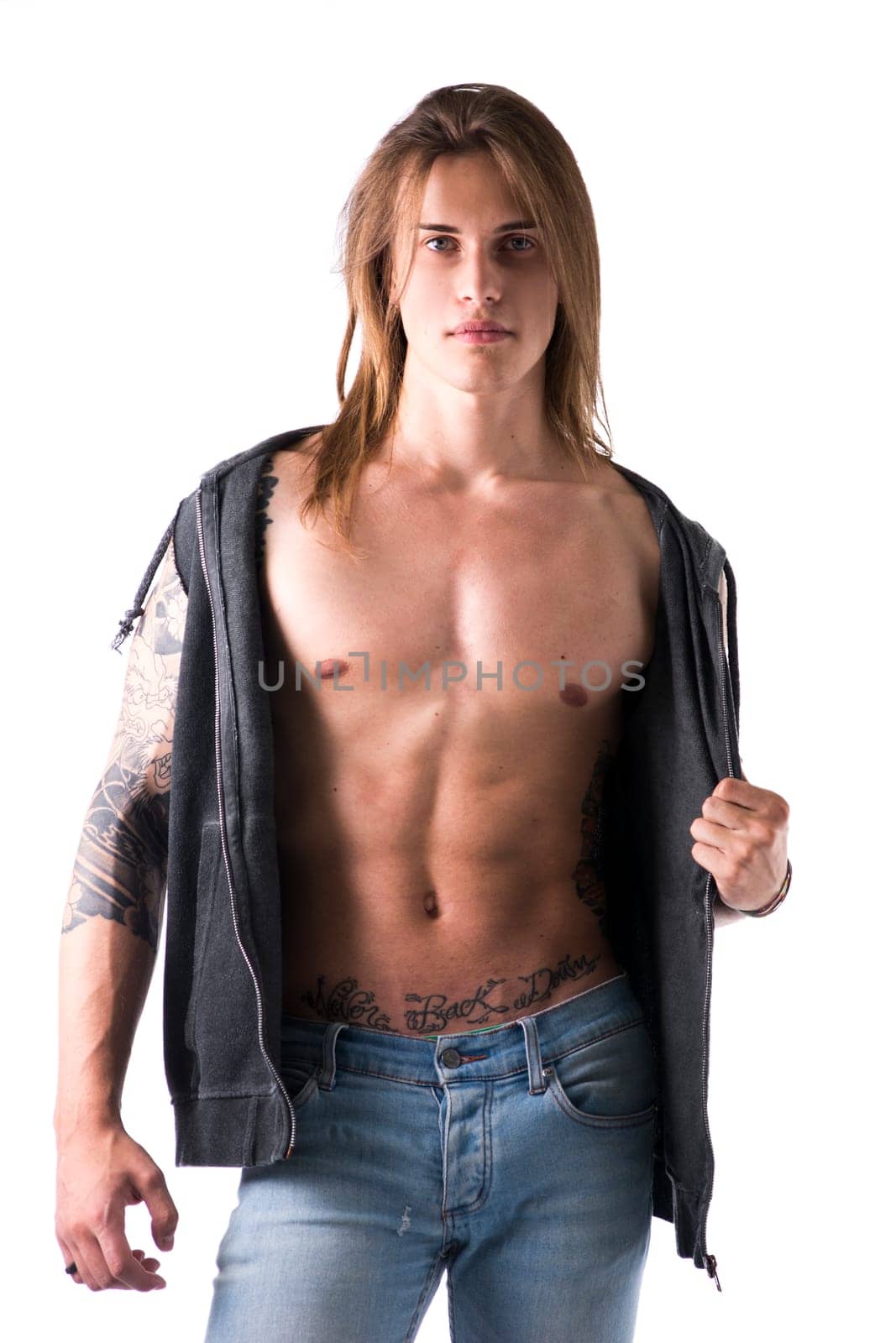 Sexy Long Hair Man with tattoo wearing Black Jacket, isolated on White